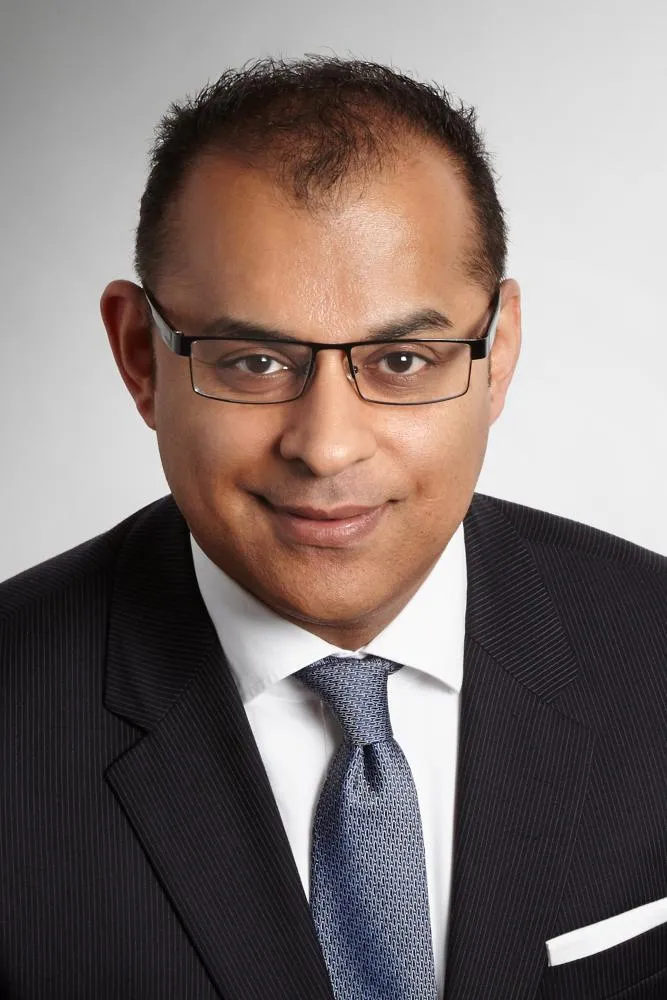 a headshot of Robin Dhir