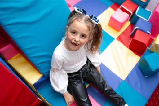 Smiling child learning in sensory rooms