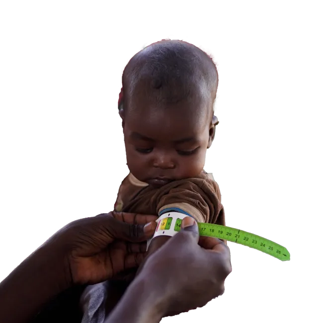 Young child having bicep measured.