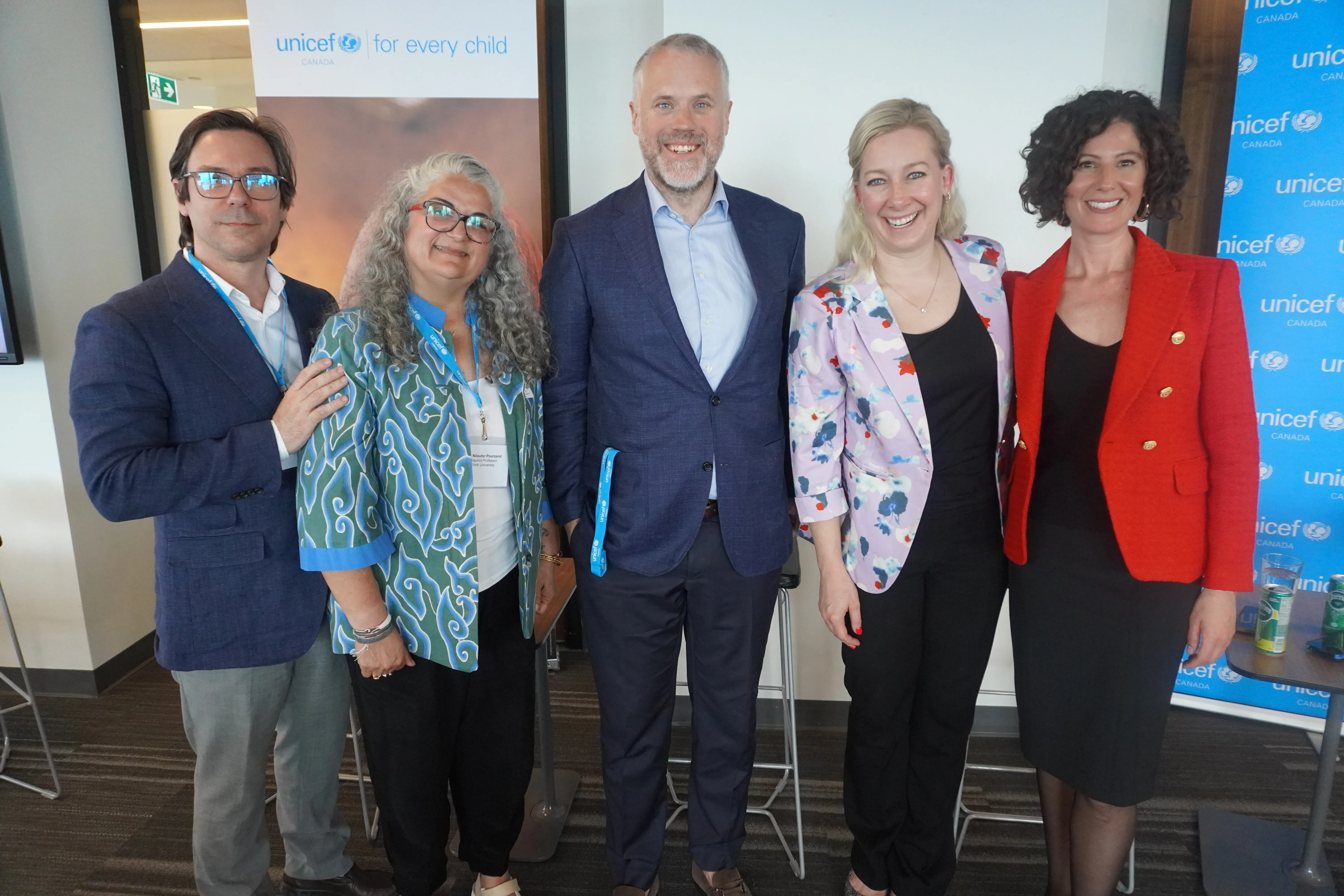 Group photo of the panel participants during the event. 