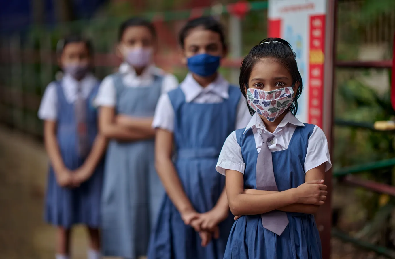 A group portrait of students wearing masks inside the school premises at Gandaria Mohila Shomity Government Primary School, Dhaka, Bangladesh on 12 September 2021.