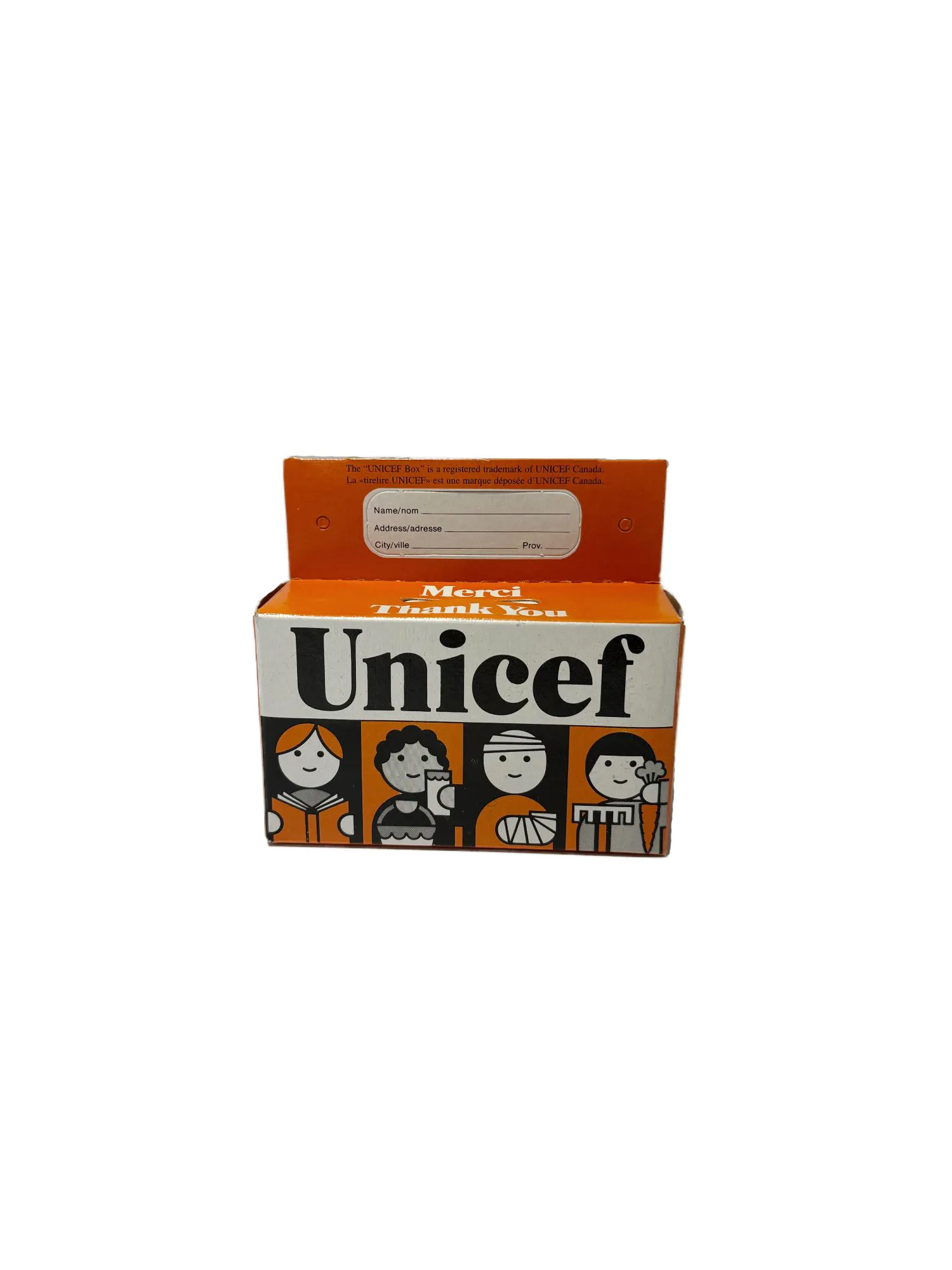 Gros plan sur la tirelire orange de l’UNICEF pour l’Halloween.