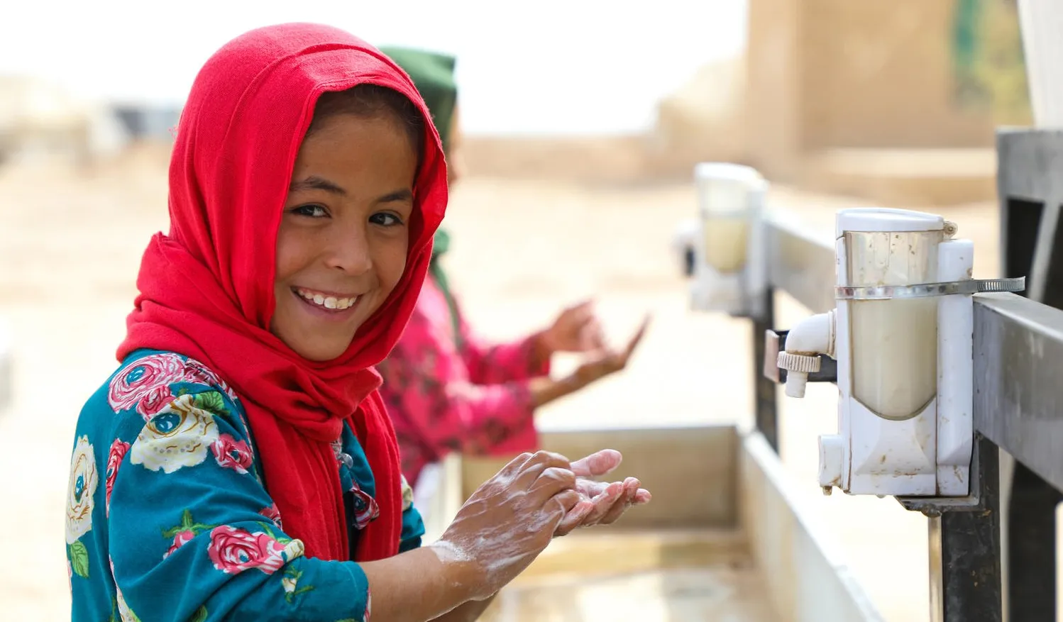 Child washing their hands