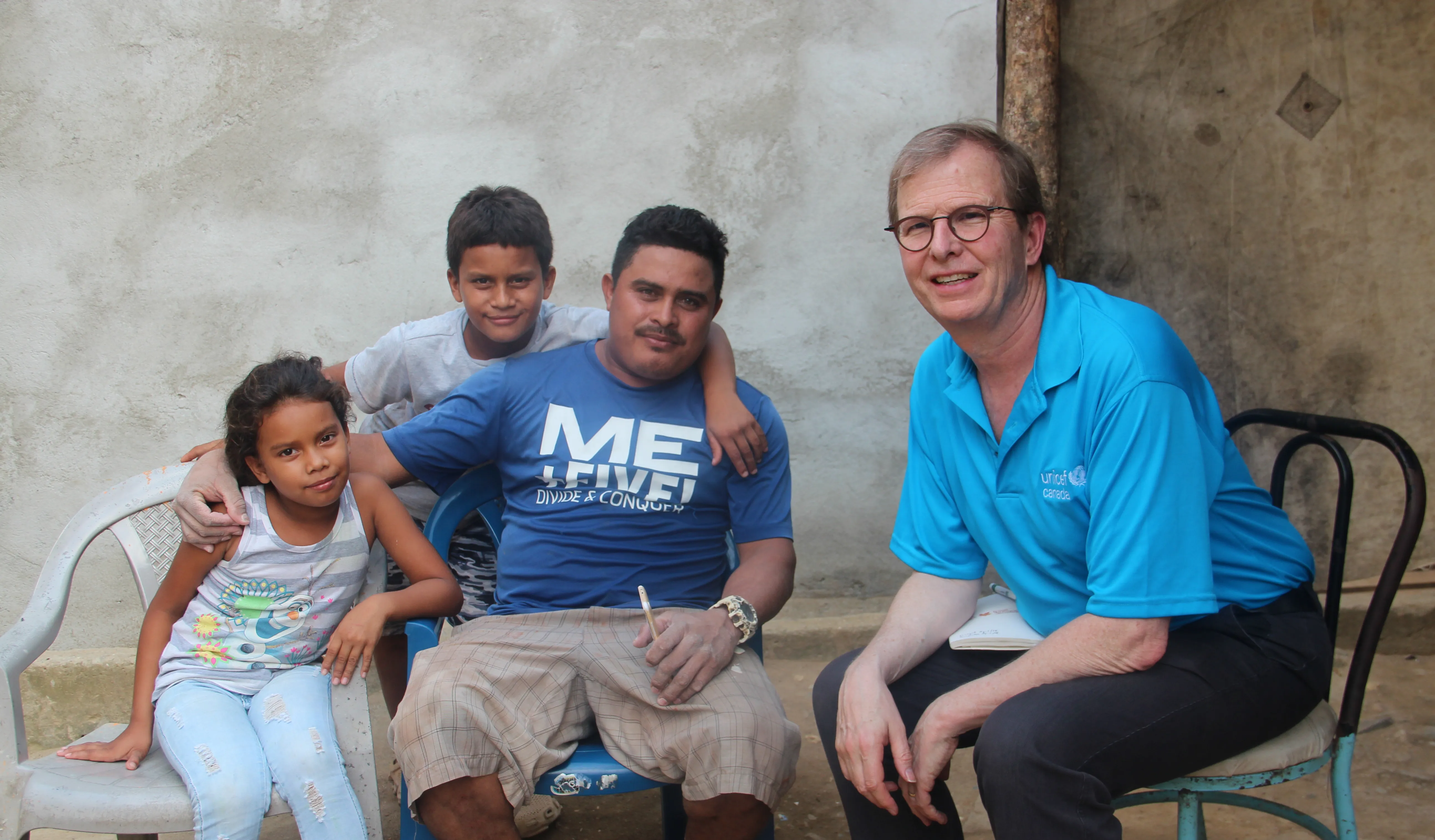 David with a migrant family in Honduras.