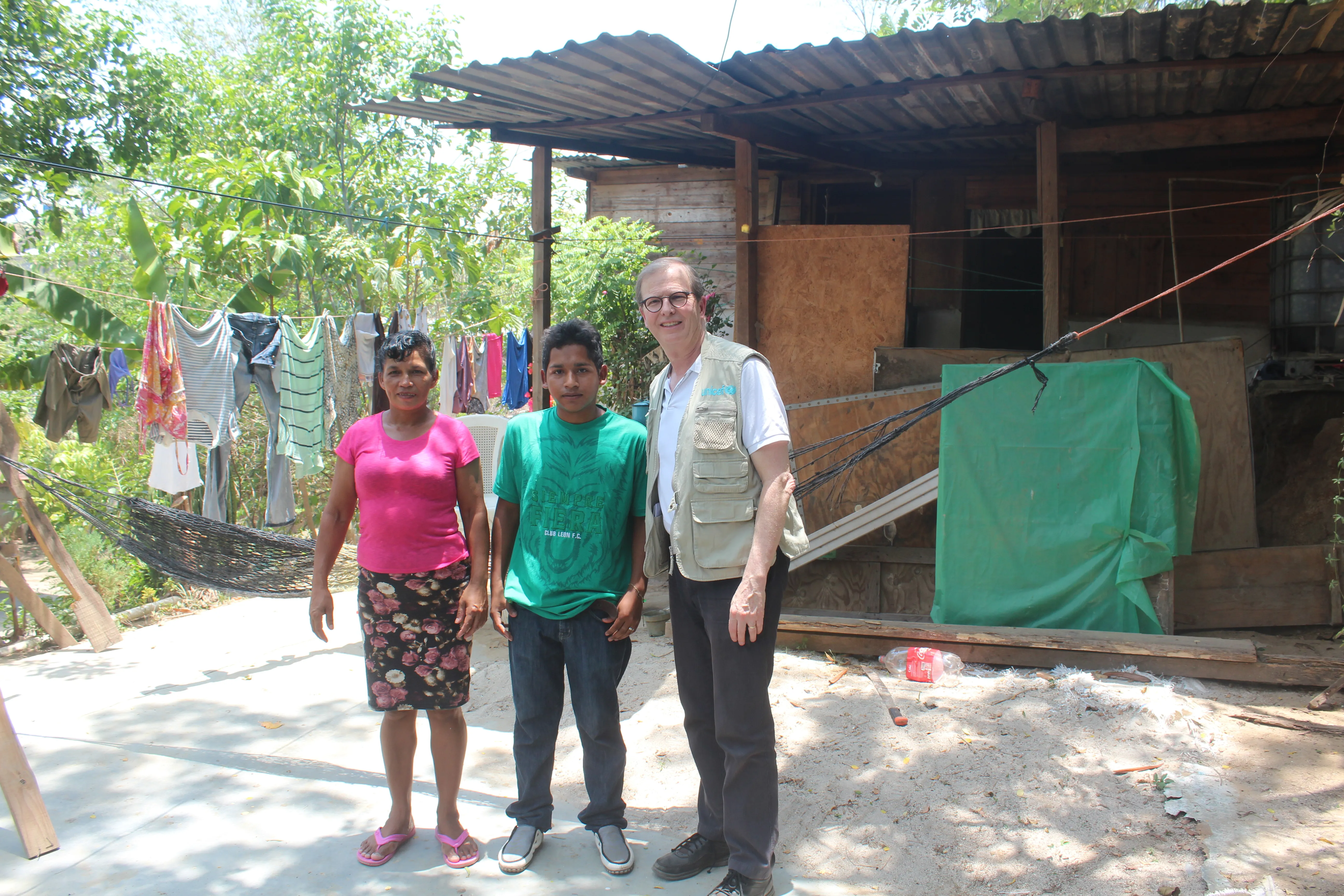 David poses with a migrant family in Honduras.