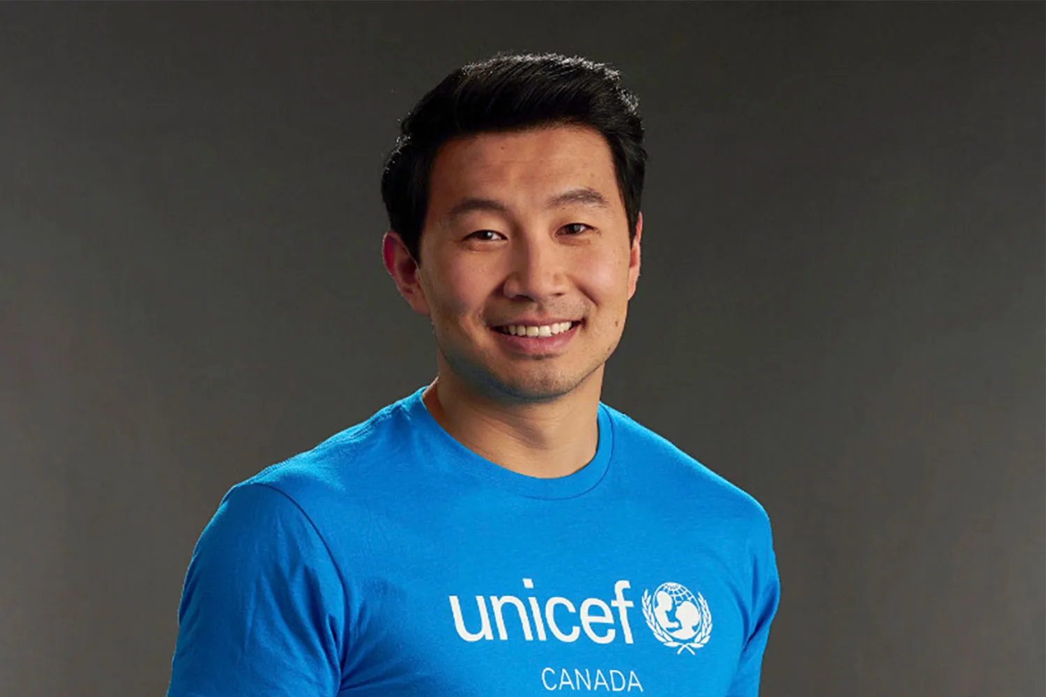 Simu Liu in a cyan UNICEF Canada T-Shirt