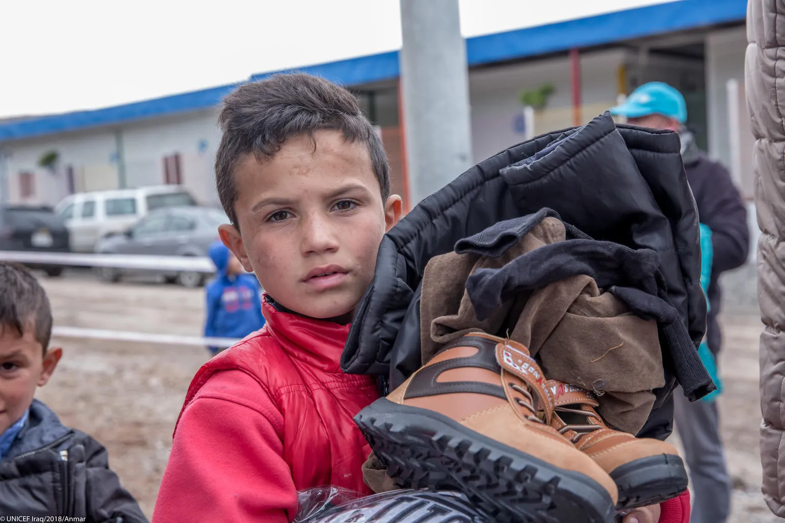 boy receives winter clothes