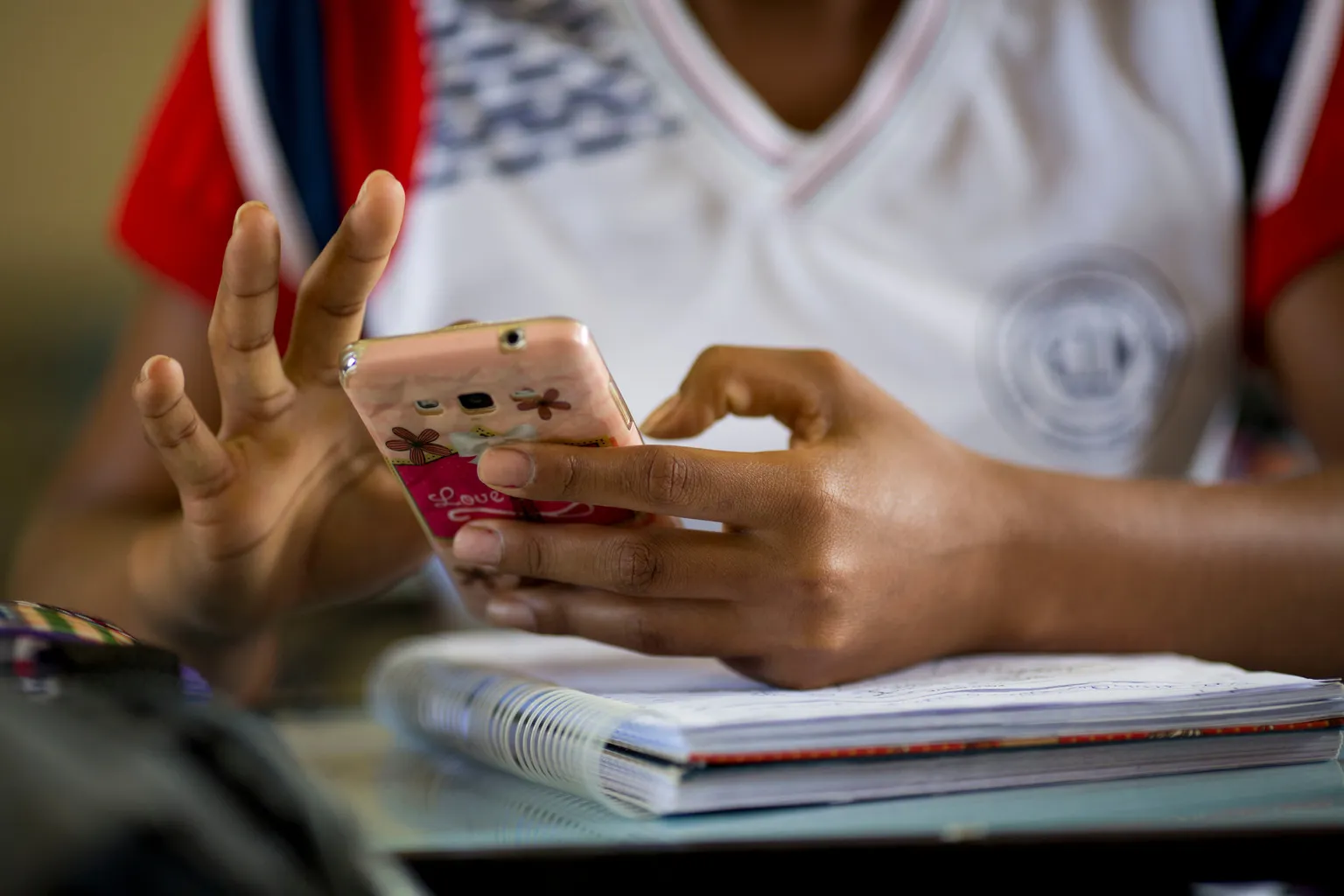 A student uses a mobile phone.