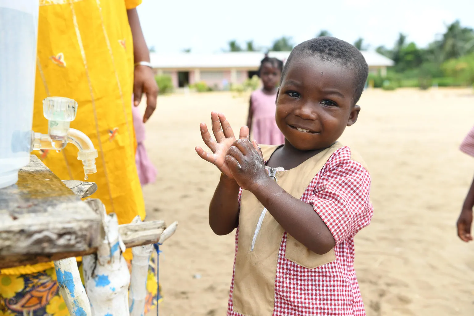 Children wash their hands at school.