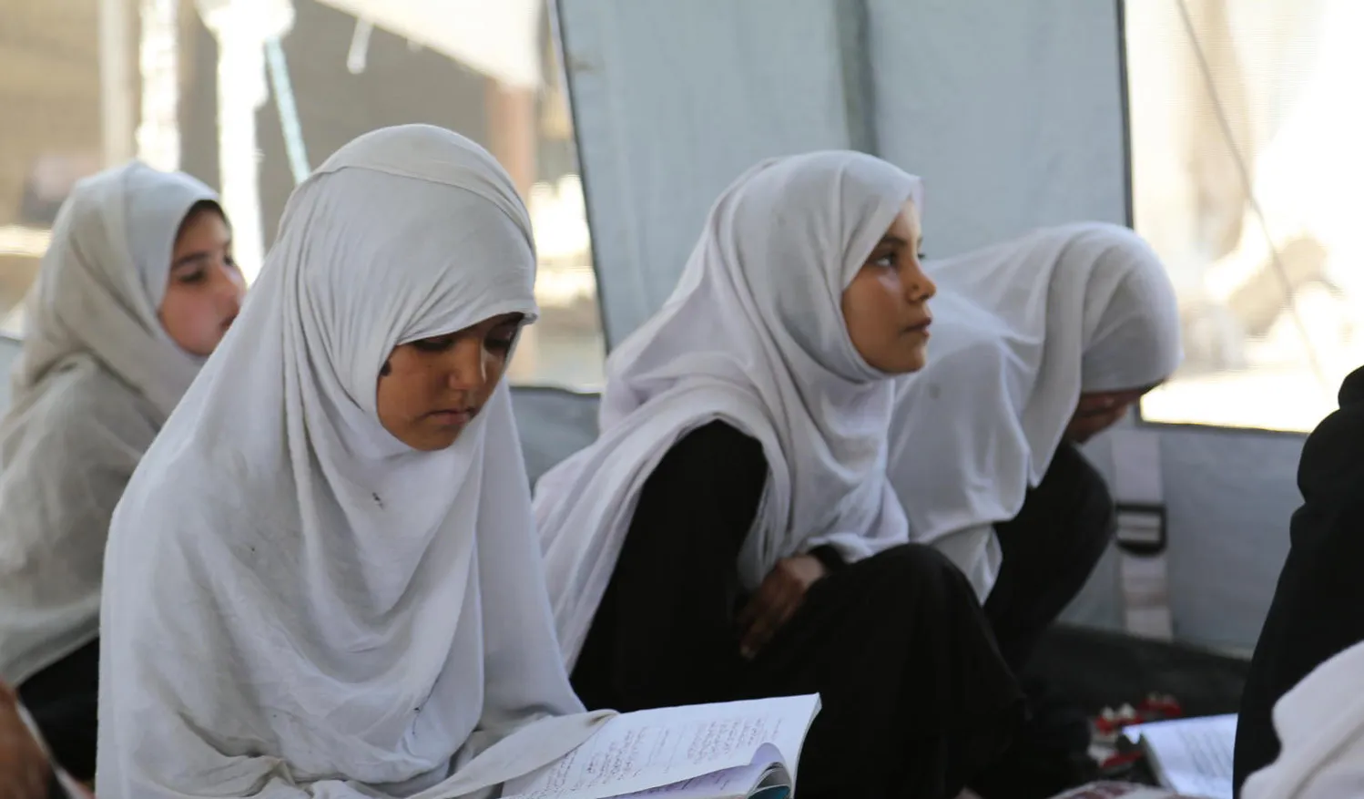 A 9-year old girl in class at a ‘tented school’ on the outskirts of Jalalabad town, eastern Afghanistan.