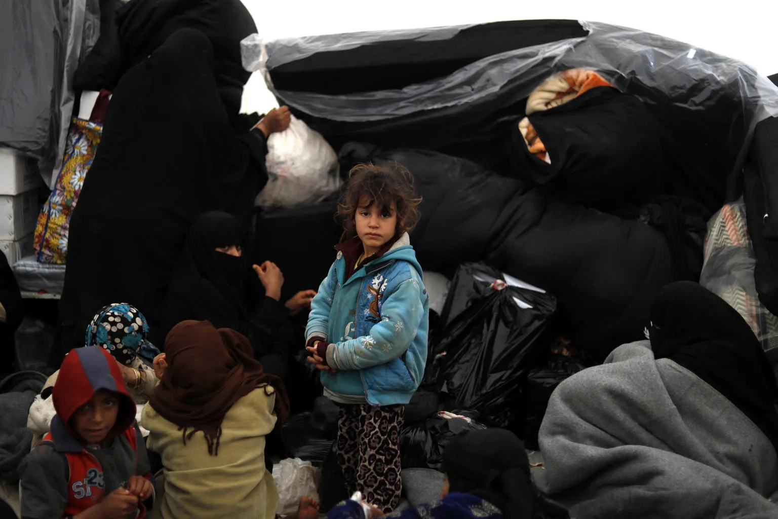 Families are welcomed into tents in the reception area of Al-Hole camp, in Syria. December 2018