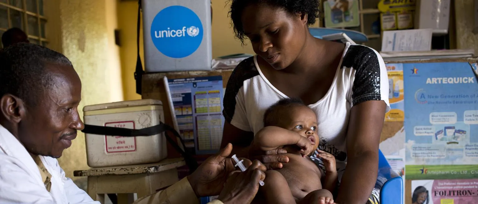 baby receives vaccination in DRC
