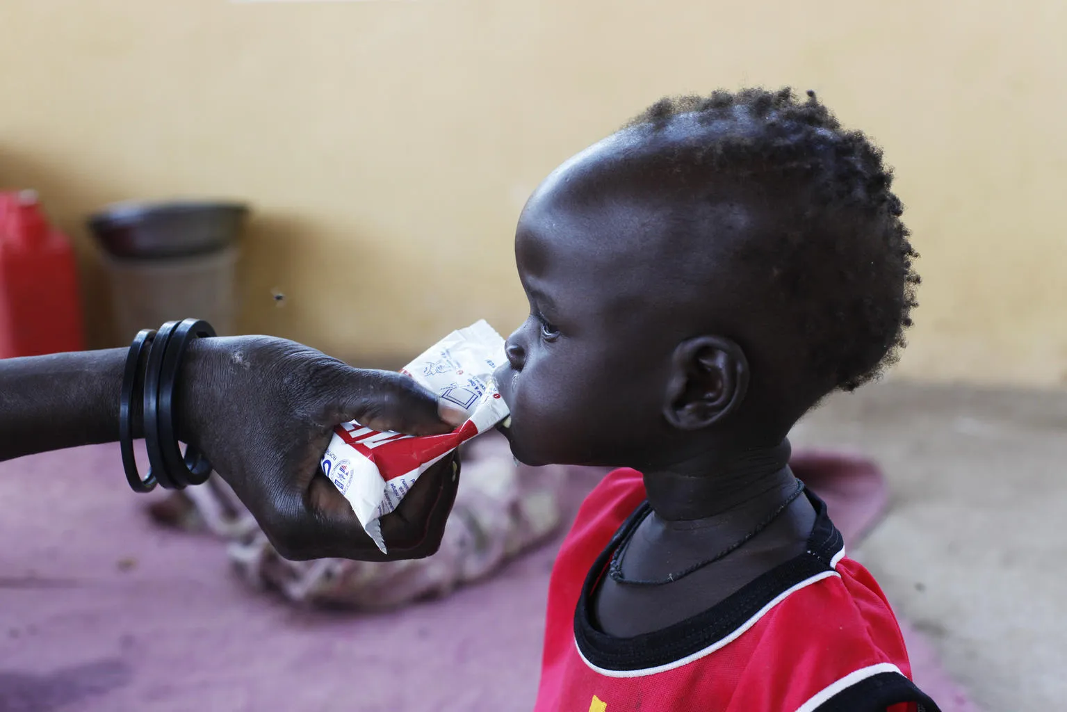 Children eating nutrition supplement 