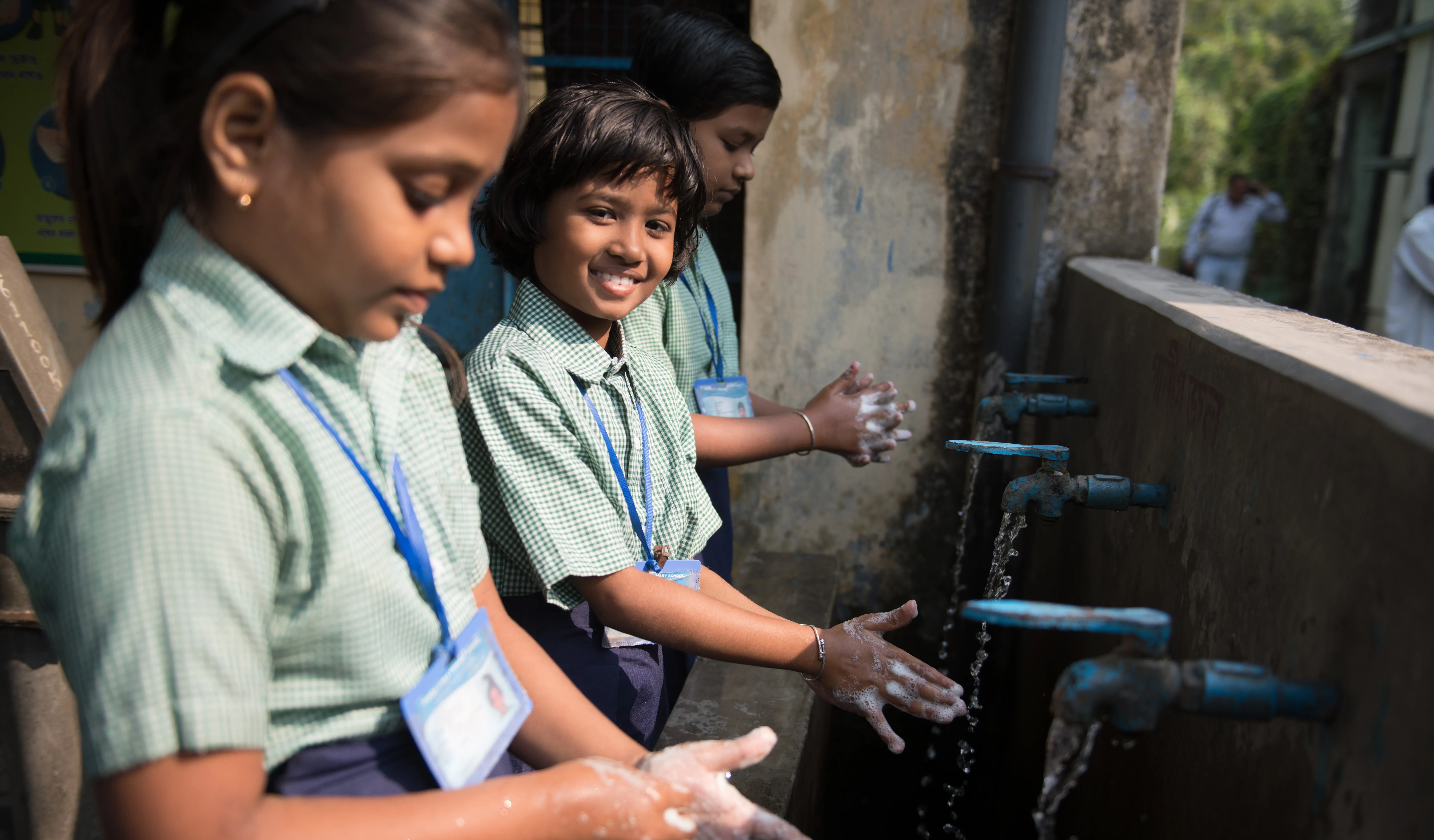 Student wash their hands in India. 