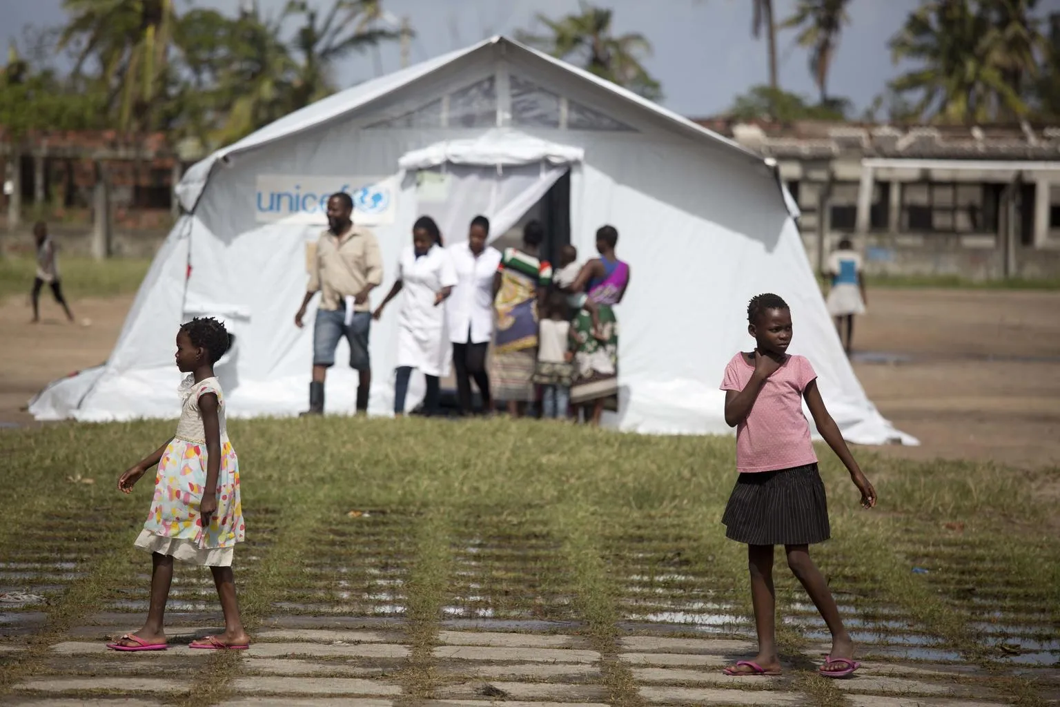 Girls in front of a tent