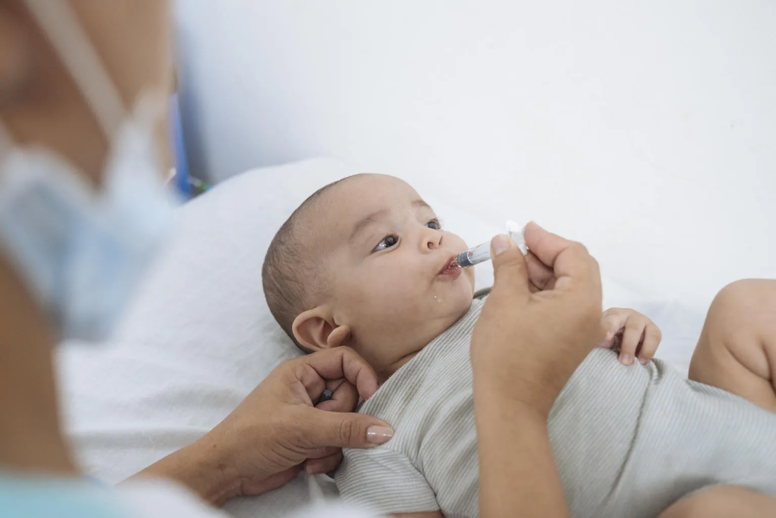 baby receives vaccines in Venezuela