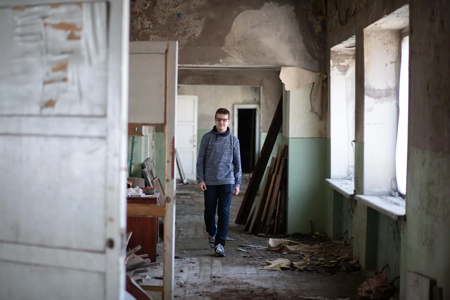 teen walking in a school