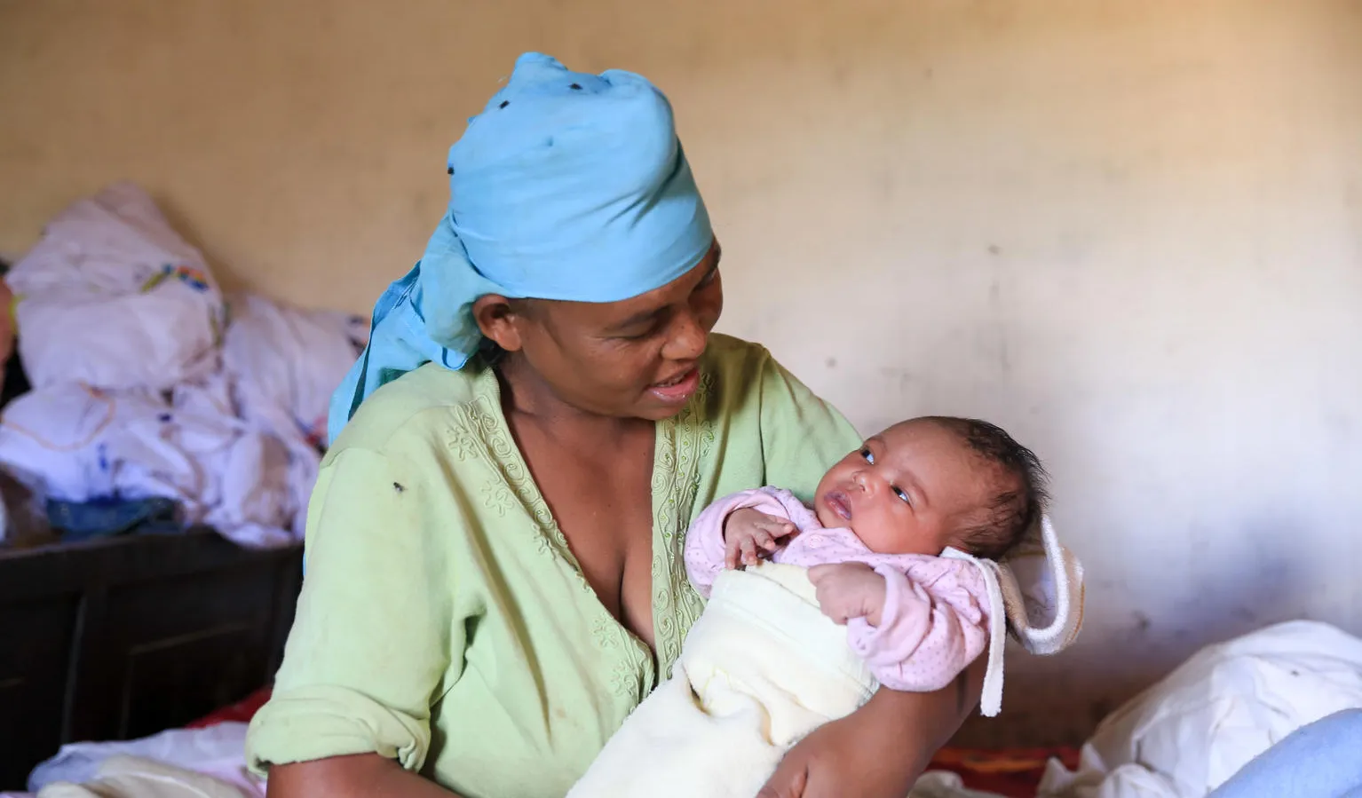 mother holds baby in Madagascar