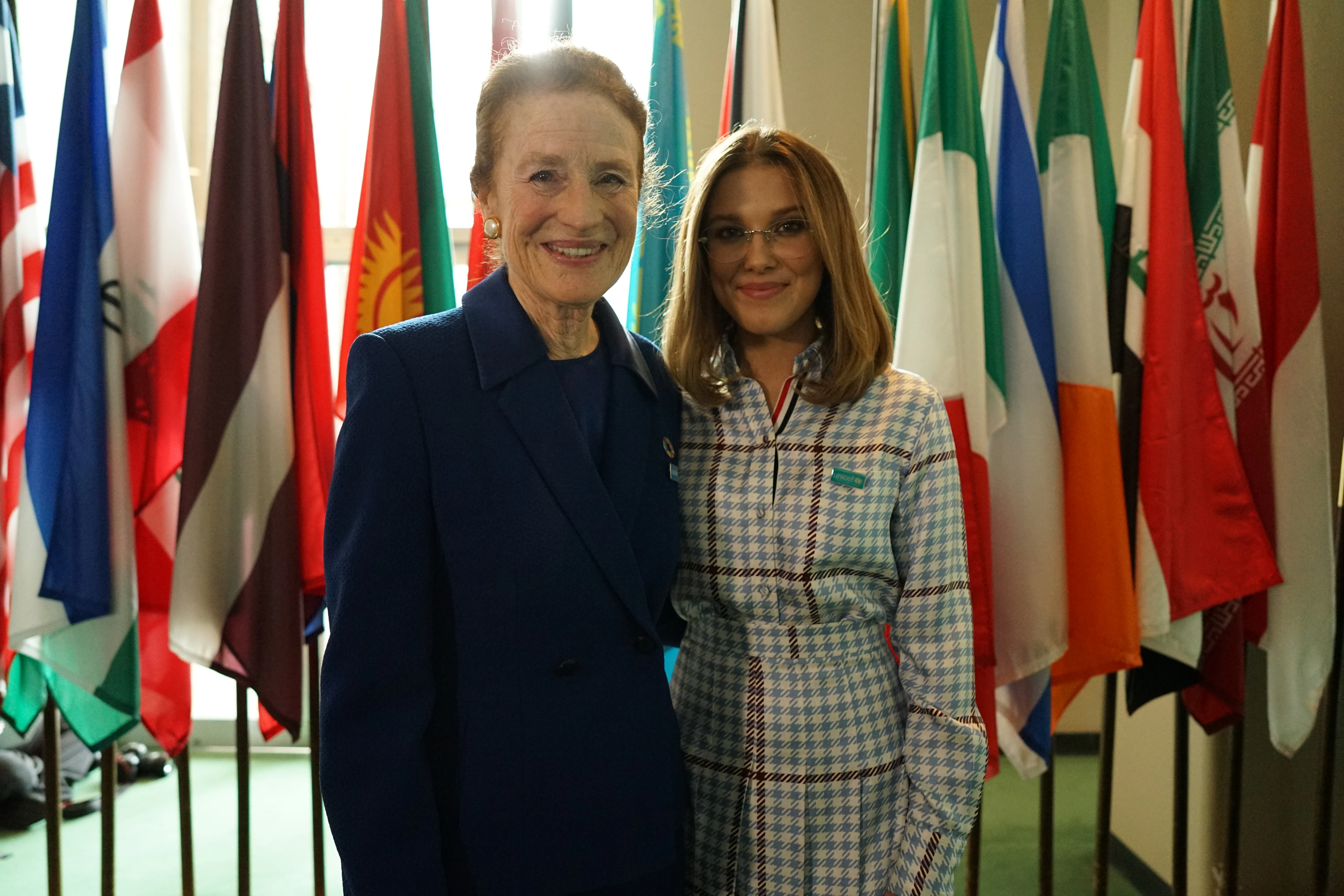 Executive Director of UNICEF Henrietta Fore posing for photo with Goodwill Ambassador Millie Bobby Brown at World Children's Day event in 2019.
