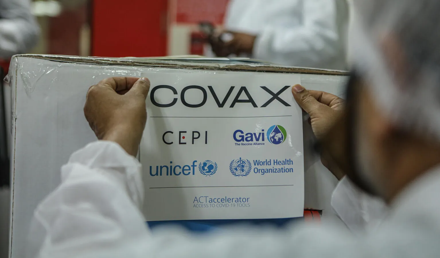 In India, on 23 February 2021, an employee packs and prepares for shipment a box containing COVID-19 vaccines for the COVAX facility at a manufacturer in Pune, a city located in the western Indian state of Maharashtra.