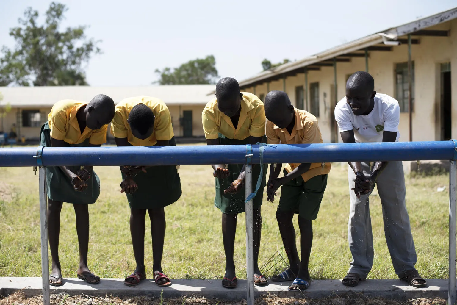 Children wash their hands at a UNICEF supplied WASH station