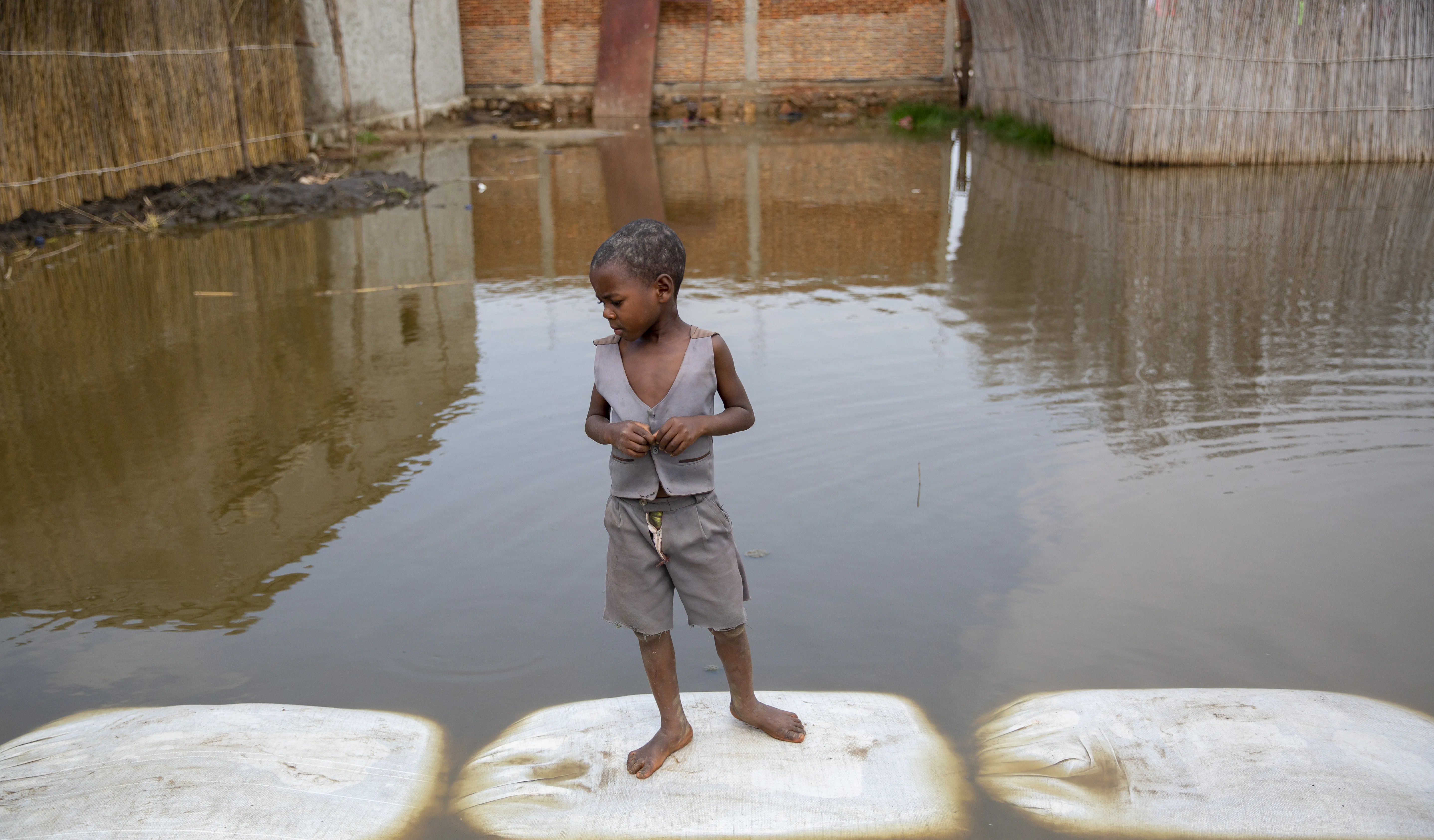 On 4 March 2021, a child plays in the floodwaters in Gatumba, located near Bujumbura in Burundi. At least 50,000 people have been affected by the floods in the region in the past year. A few kilometres from the floodwaters, a big IDP camp has been formed to shelter people displaced by the flooding. Burundi is extremely vulnerable to climate change and climate change -triggered natural disasters- and as one of the poorest countries in the world, it has very little means to protect its population.