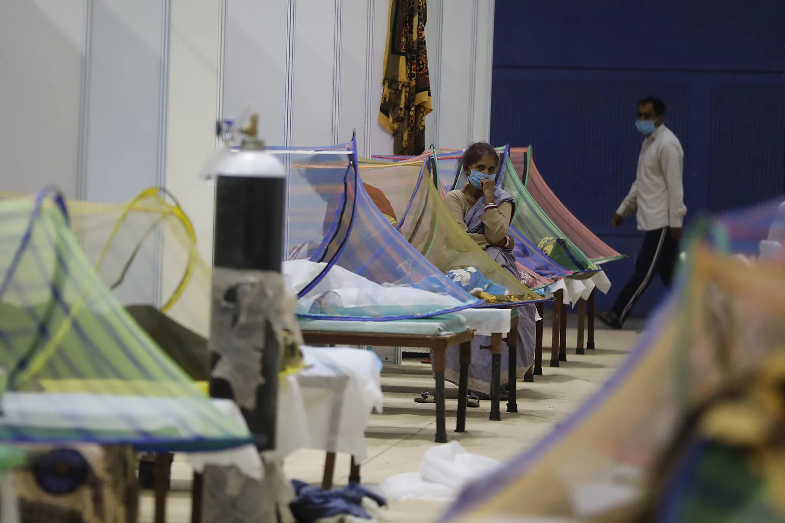 On 2 May 2021, patients receive treatment in the COVID-19 care centre at the Commonwealth Games Village (CWG) in New Delhi, India.