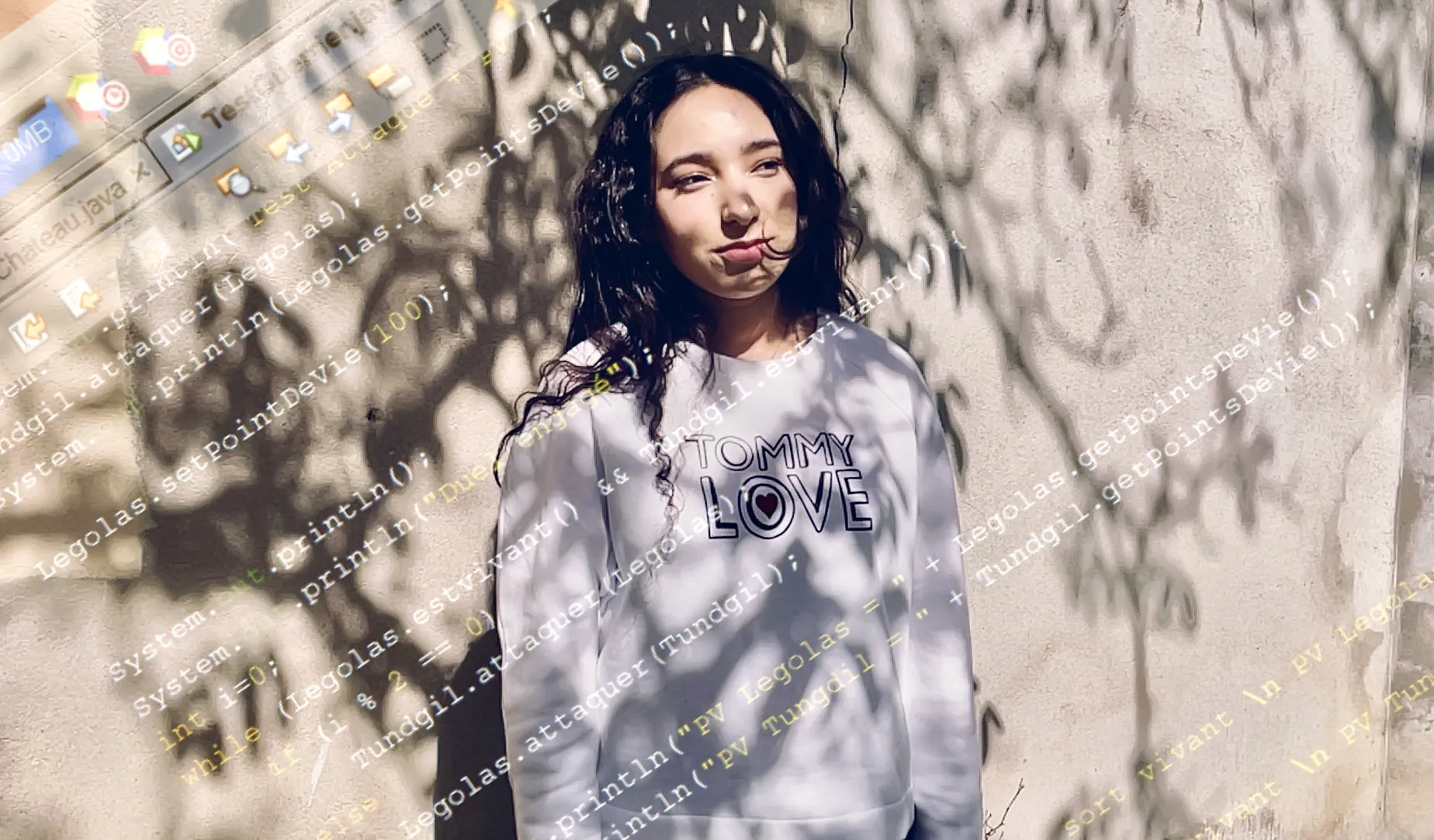 Houda, 19, poses for a portrait outside her family’s home near Grenoble, France.