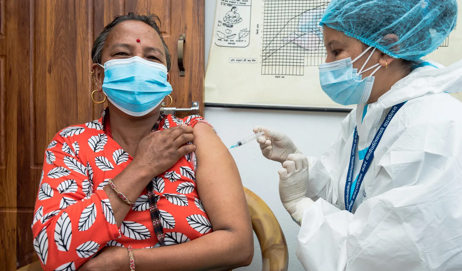 On 22 July 2021 at the Dapcha Health Post in Kavre District in central Nepal, 53-year-old Bijuli Devi Tamang receives the Johnson & Johnson COVID-19 vaccines donated to Nepal through the COVAX Facility. 