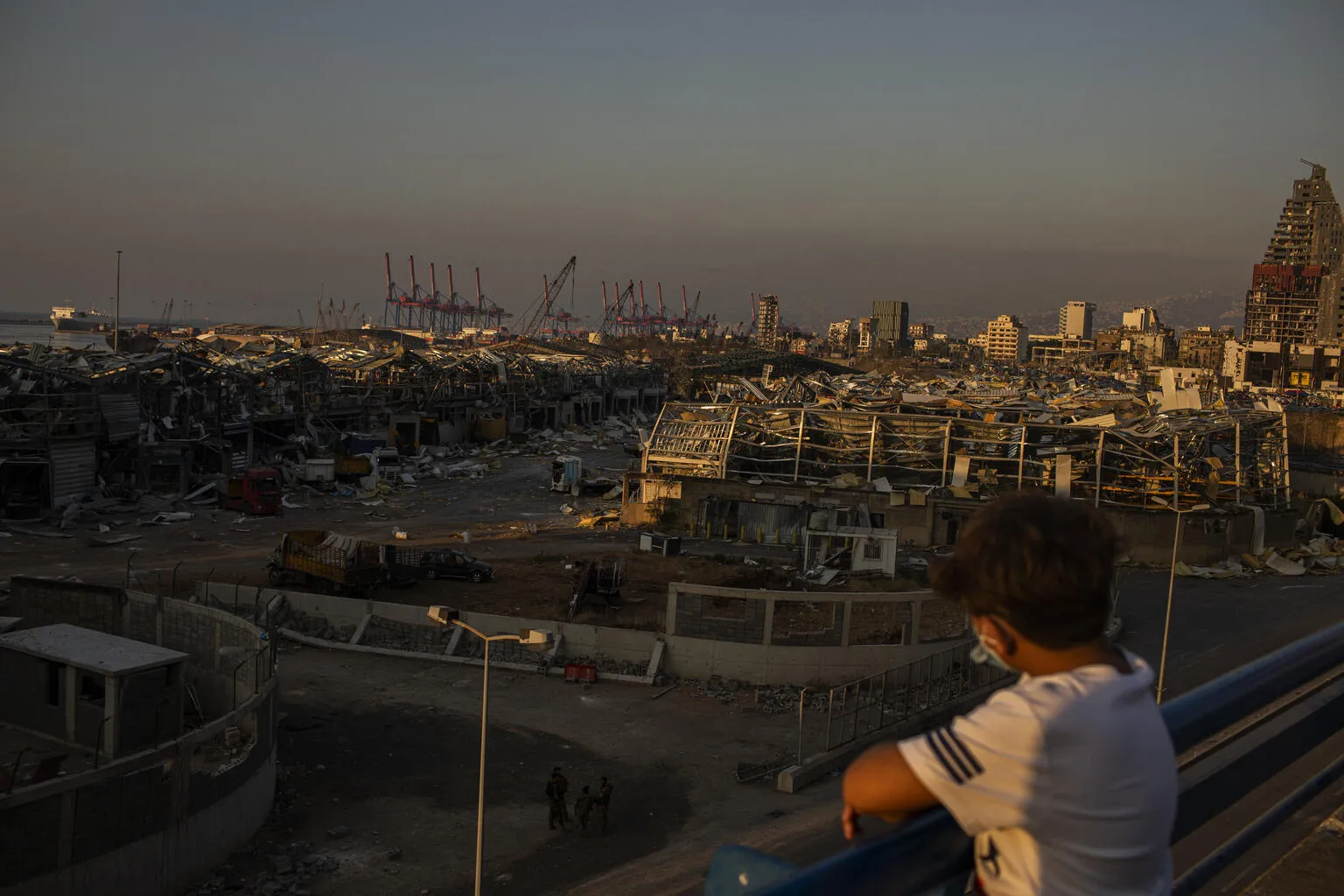 A young Lebanese looks over the area of the Beirut Port explosions on Thursday, August 6, 2020. The massive blast killed more than 20 people including six children; over 6,500 injured including an estimated 1,000 children.