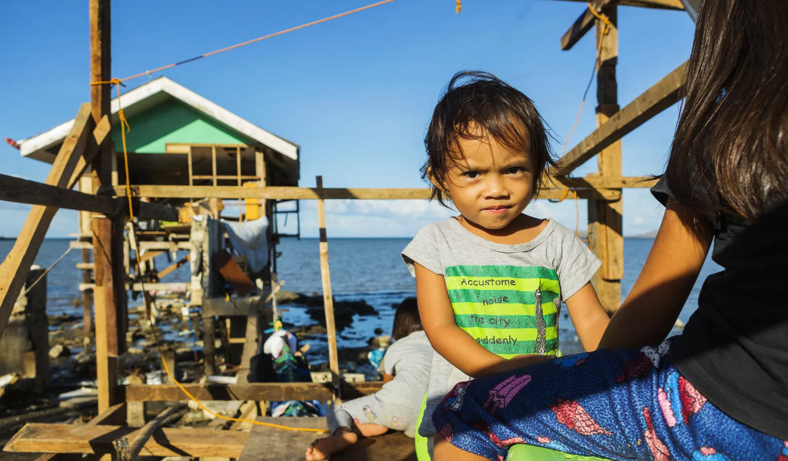 Gwendolyn Miano, 2, stands in the house her family has already started rebuilding December 20, 2021 in Barangay Fatima, Purok 1 in Ubay, Bohol, Philippines.