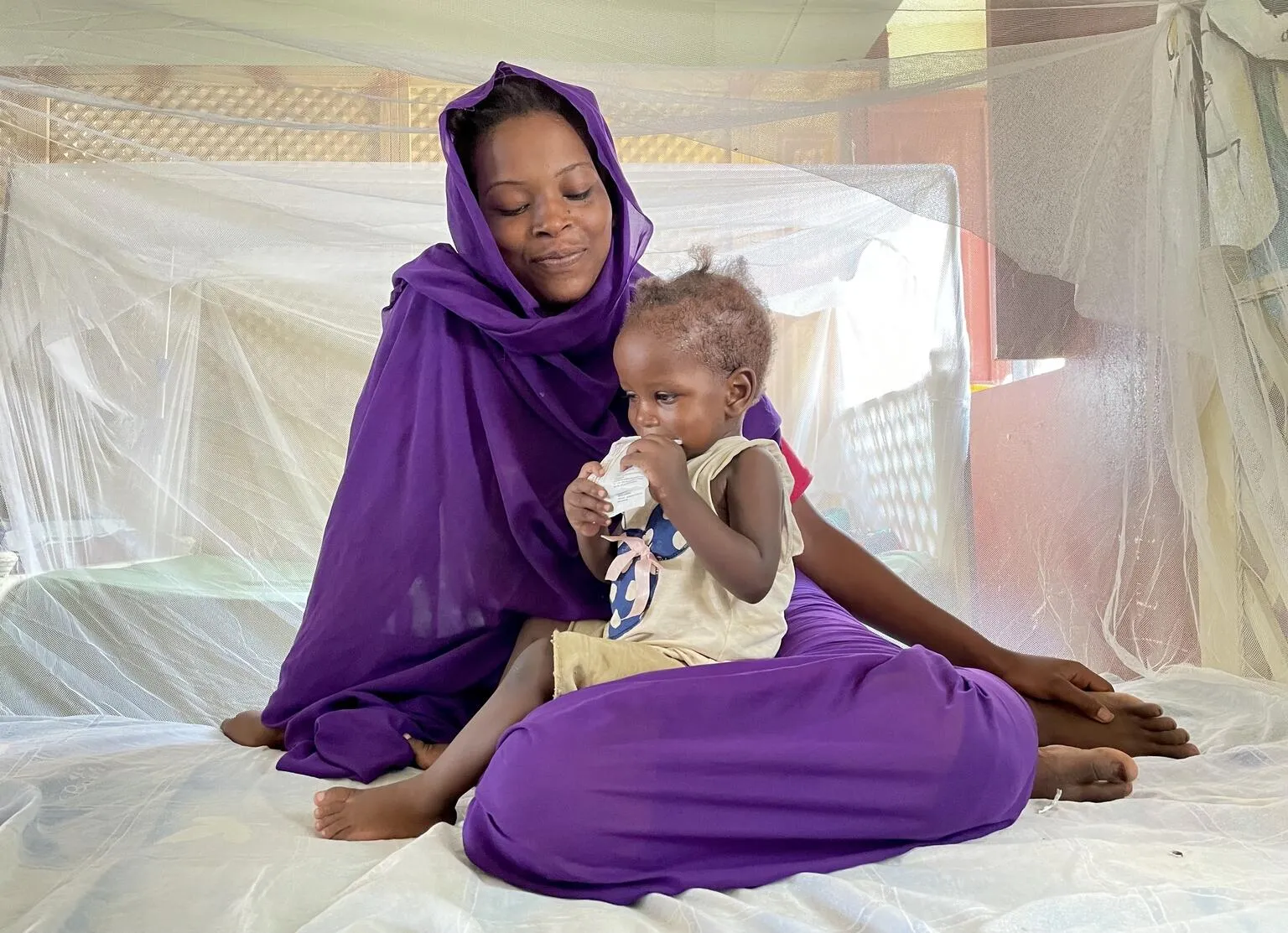 A girl receives ready-to-use therapeutic food in a stabilisation center in El Fasher, North Darfur. Unfortunately, the nutrition crisis is Sudan is worsening with a record number of children admitted to this center where children suffering from severe acute malnutrition with medical complications are treated.