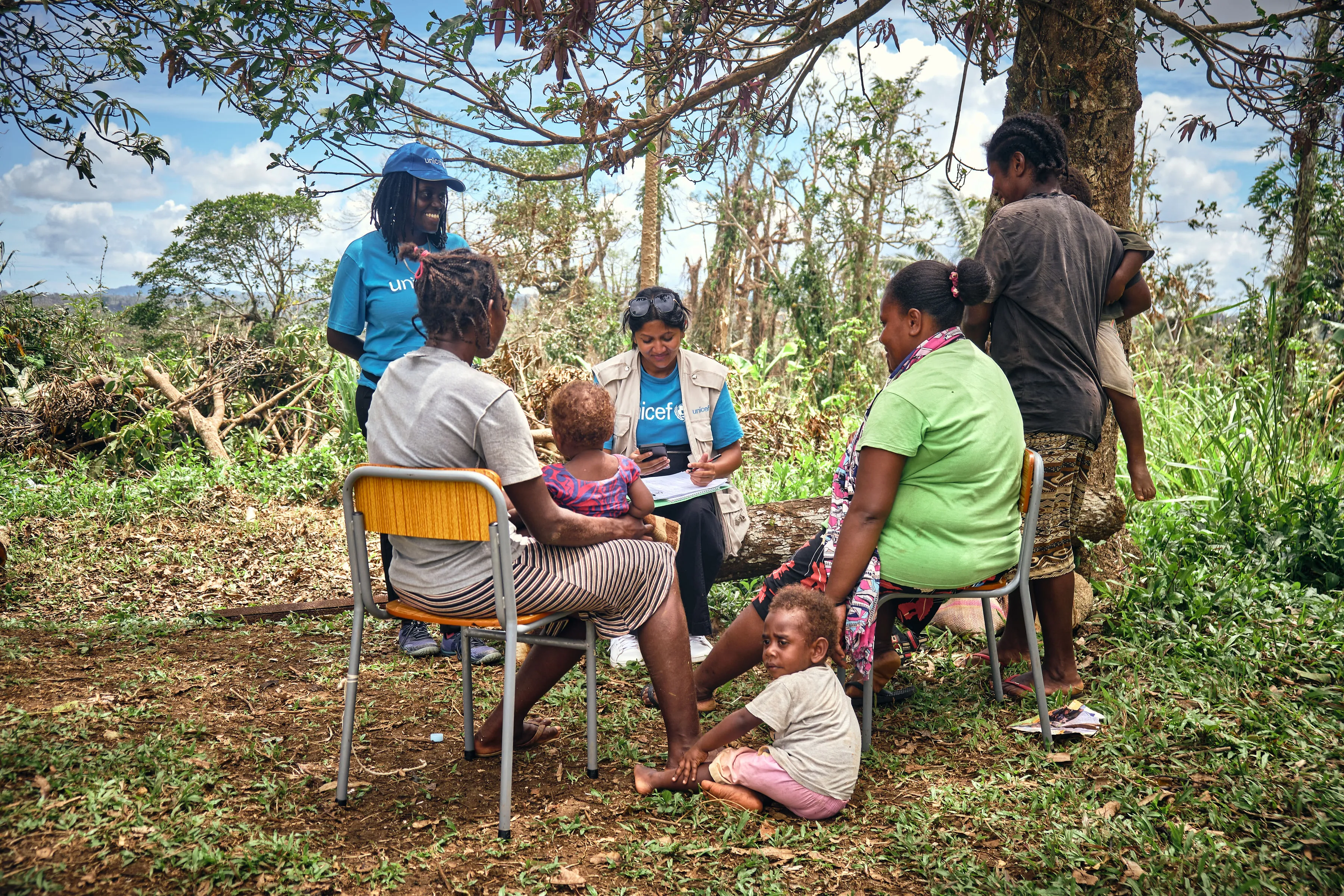 Sheenal & Esther, UNICEF staffs speaking with mothers who live in Red Graon community at Teouma.
