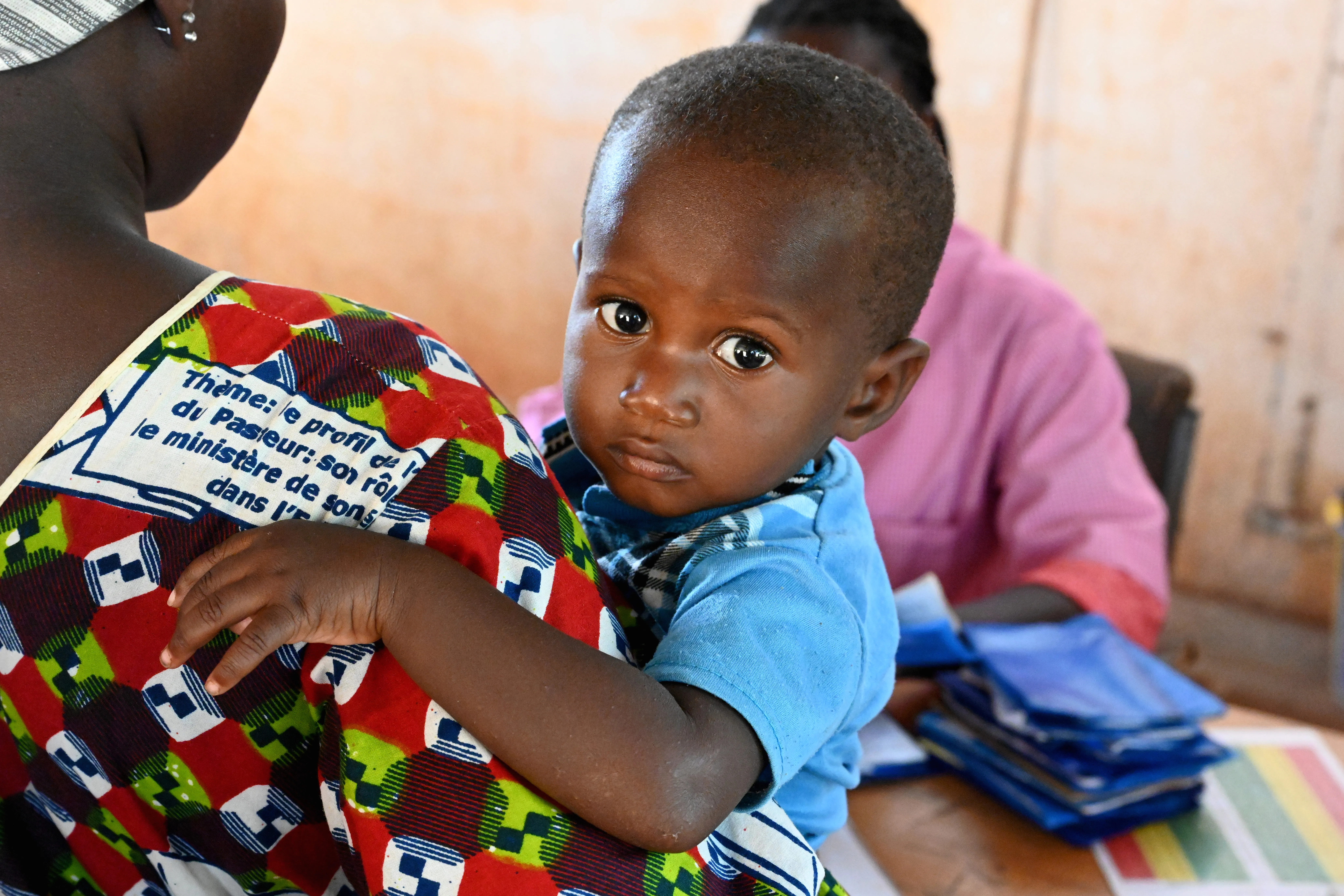 A mother with her baby at the CSPS Health Center, in Fada, in the east of Burkina Faso.
