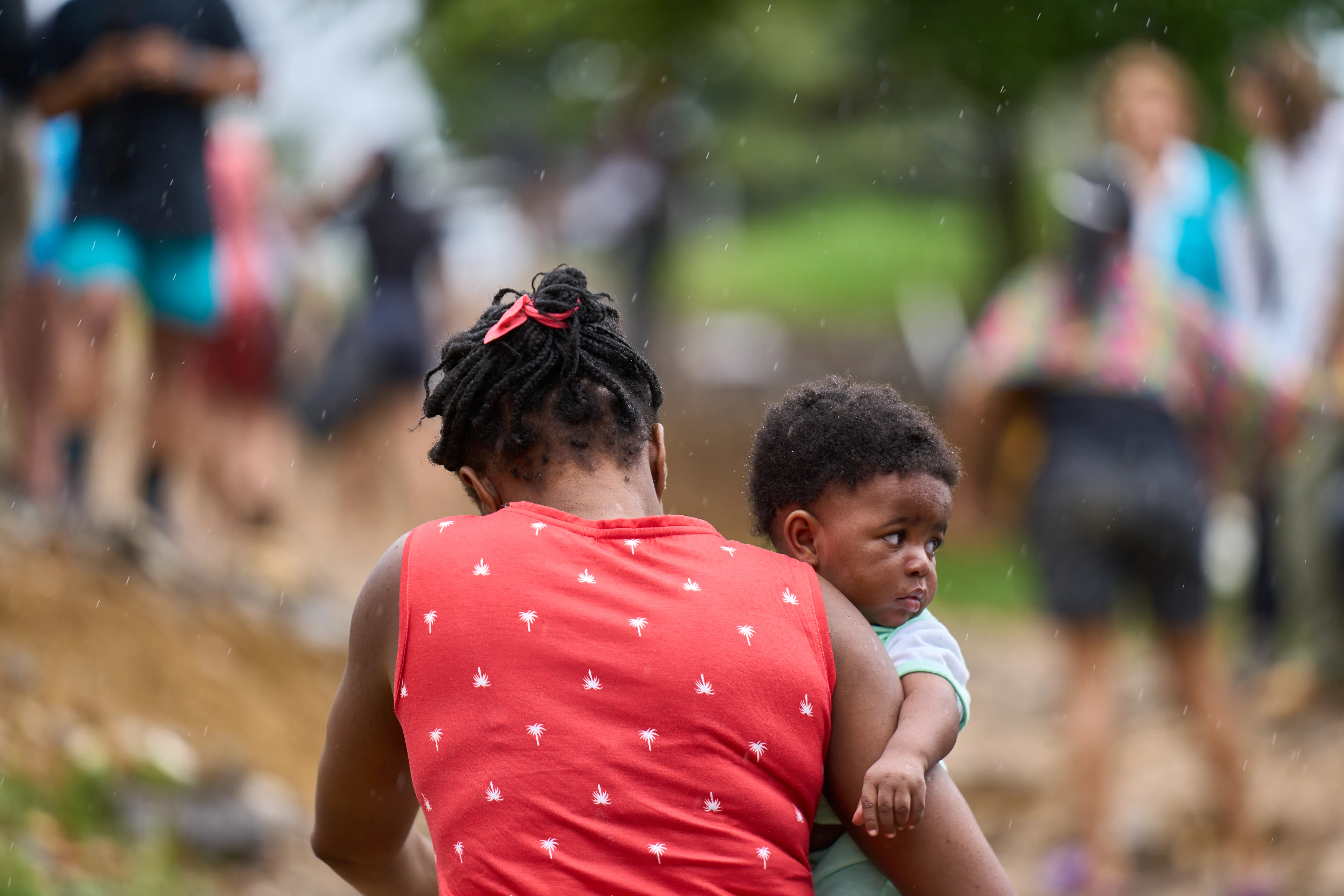 Esther, an Haitian mother of two children, arrives in pirogue to Lajas Blancas Migrant Temporary Reception Center, after crossing the Darien jungle with her husband. 