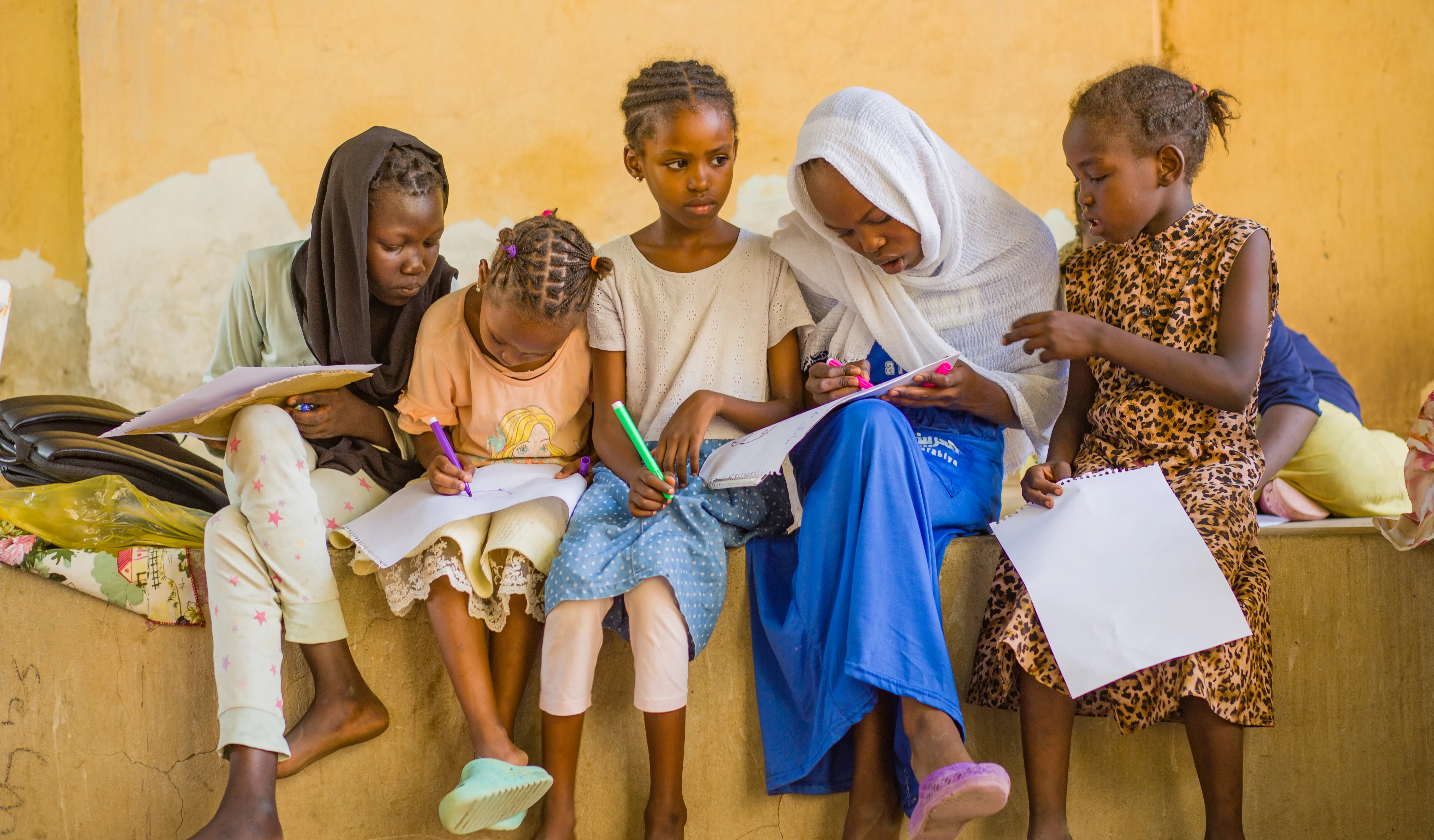 Displaced children engage in psychosocial activities at a gathering centre in Madani.