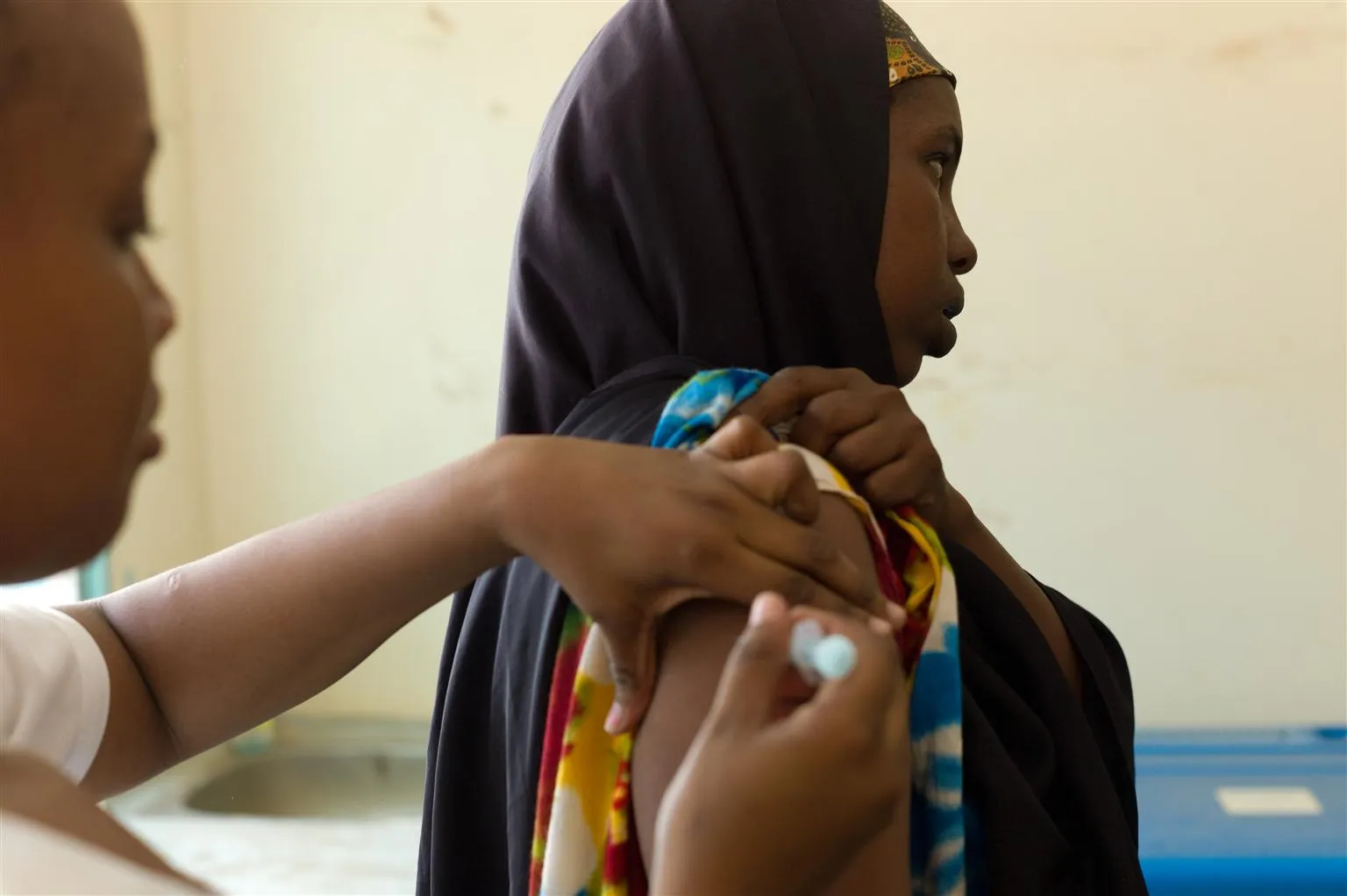 An expectant mother receives a tetanus vaccine.