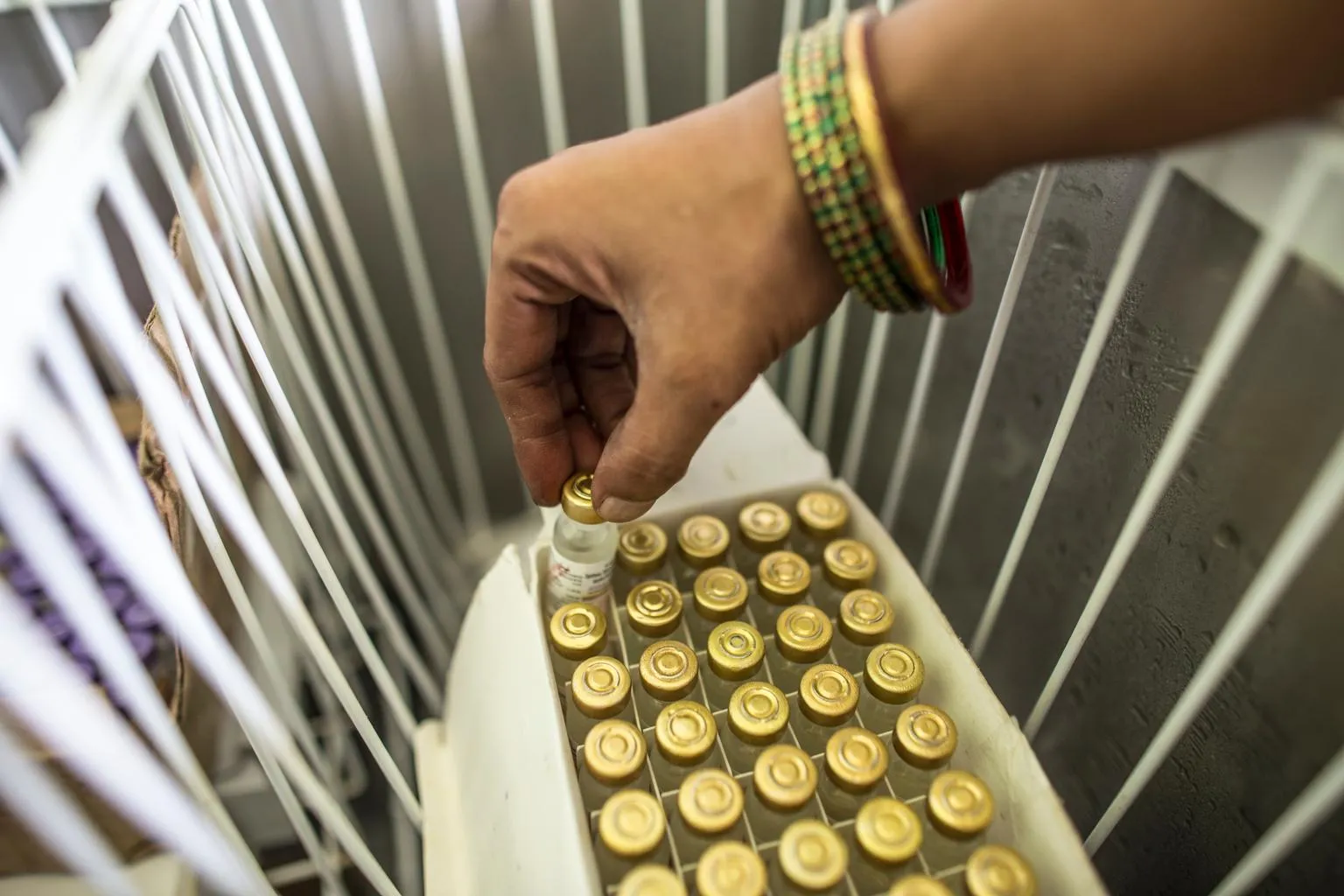 Pinky Kumari, Cold Chain Handler, prepares to keep vaccine in vaccine carriers at Primary health centre (PHE) in Begusarai, Bihar. 