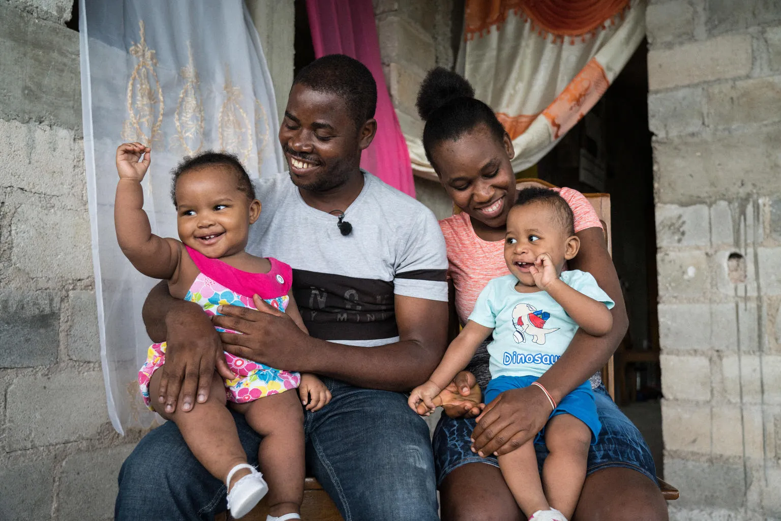 Guino Sylvain & Micherline Jean-Pierre, holding their twin children. Both assisted to a parenthood club to inform and prevent diseases coming from malnutrition. 