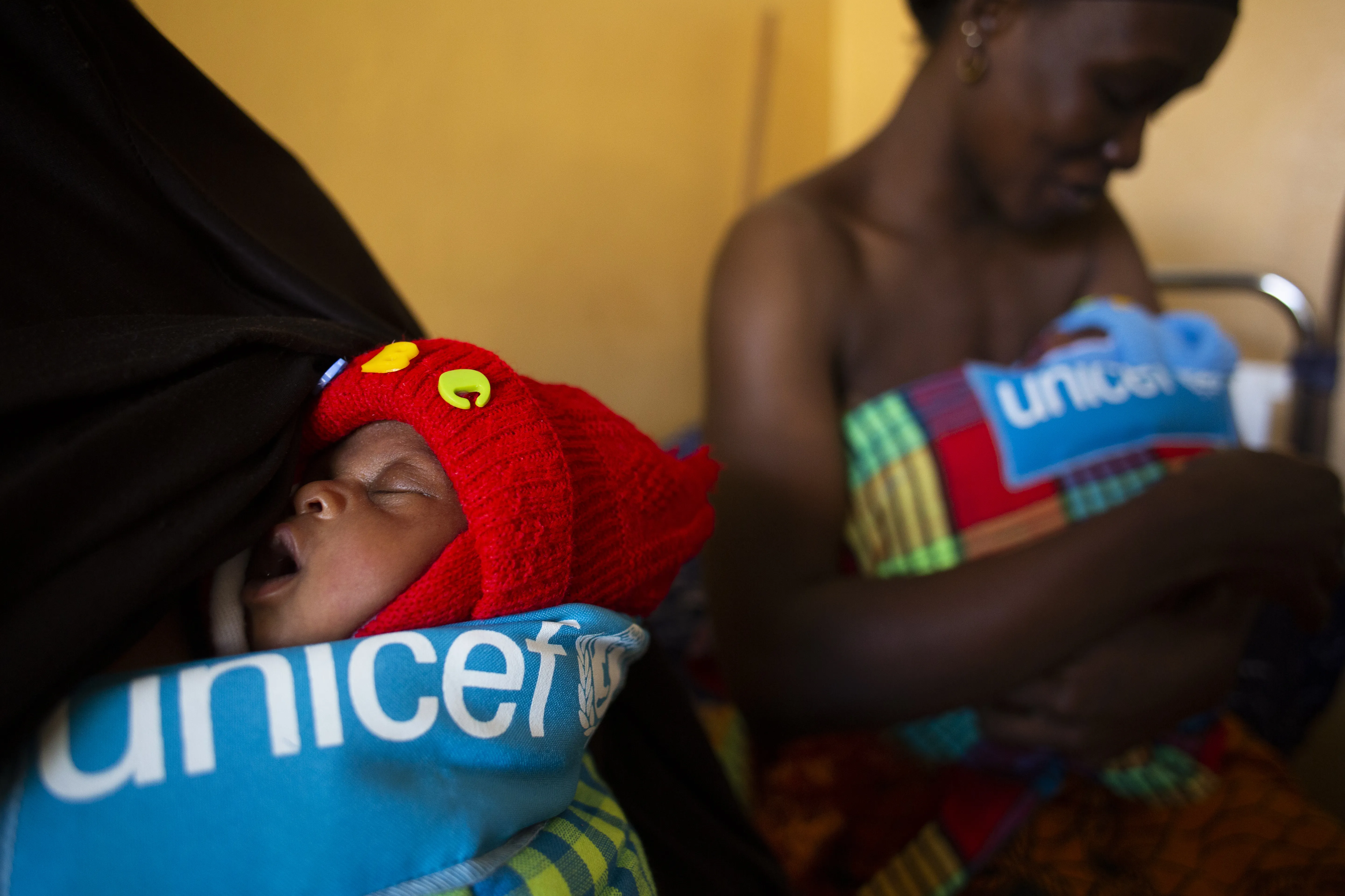 Grandmother Mampu Drami hold her grandson Mohamed after his mom Mohamed Mama Drami (34) who gave birth to twins two weeks ago at the paediatric ward in the Bafata hospital, Guinea Bissau, Thursday,17 January 2020. Unicef support the hospital by providing nutrition counselling, prevention and treatment of nutrition , HIV family testing and birth registration. Unicef Photo/Prinsloo
