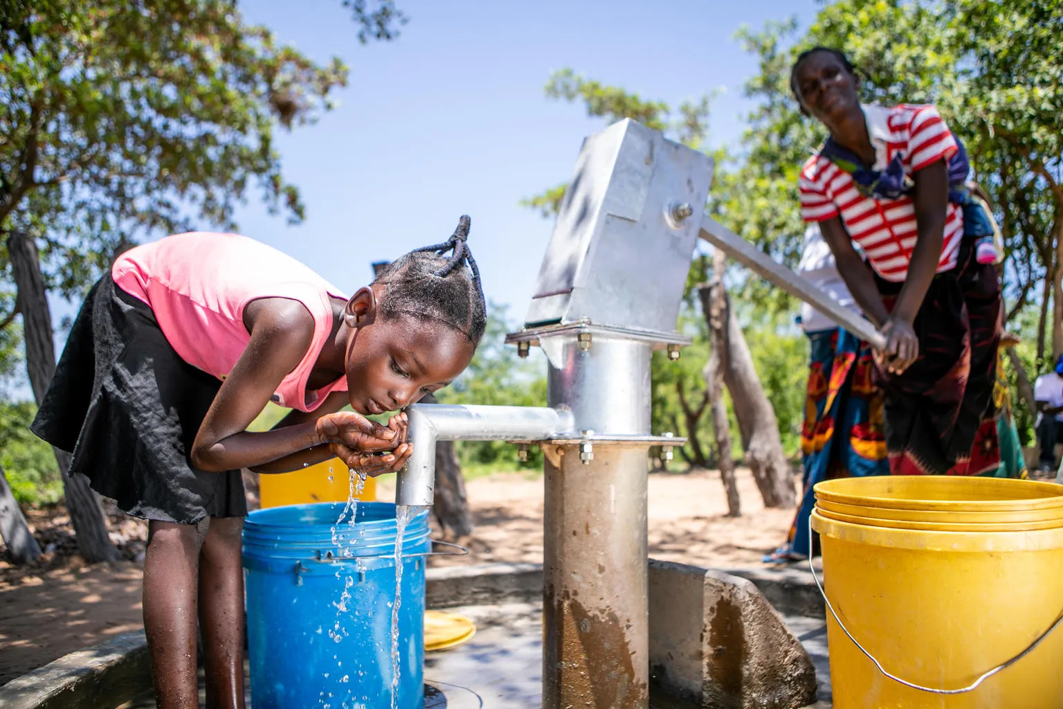 On 26 January 2020, Christine, 7, collects water from a recently rehabilitated water point in Gwembe Valley, Zambia. Severe and prolonged drought in the region have contributed to depleted water points, crop failure, food insecurity and malnutrition, impacting the health of mothers and children. To date, under the Zambian Government's drought response plan, UNICEF has supported the rehabilitation of a dozen existing boreholes in Gwembe District. In total, UNICEF will drill 100 new boreholes and rehabilitate
