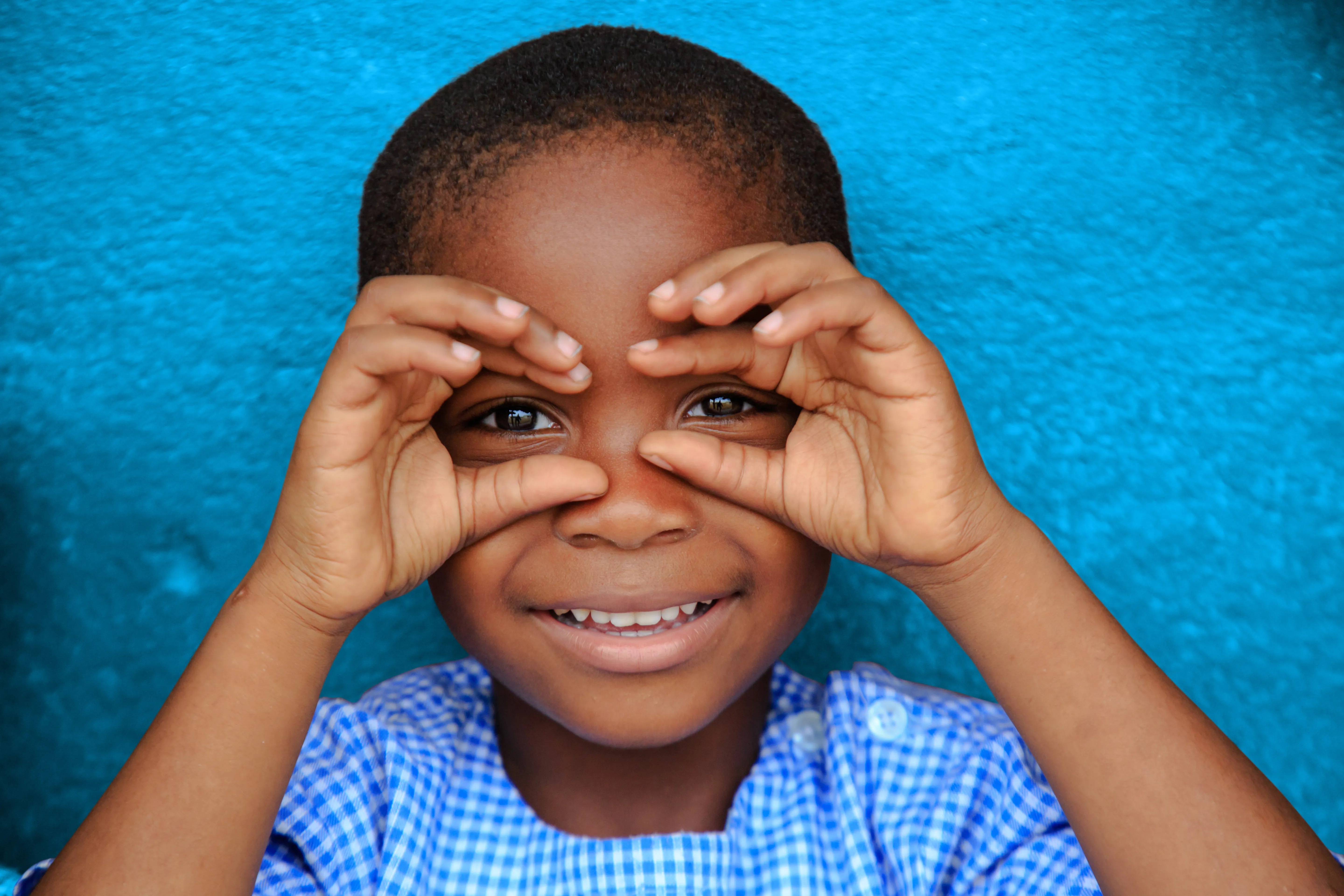Happy child smiling in Gonzagueville, in Abidjan, Côte d'Ivoire.