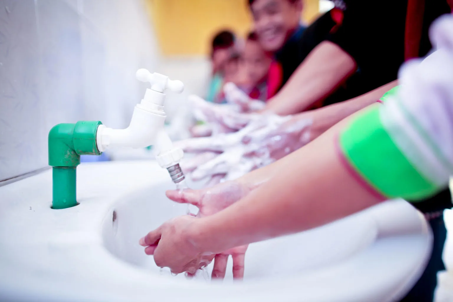 Children wash their hands at a primary school in Vietnam.