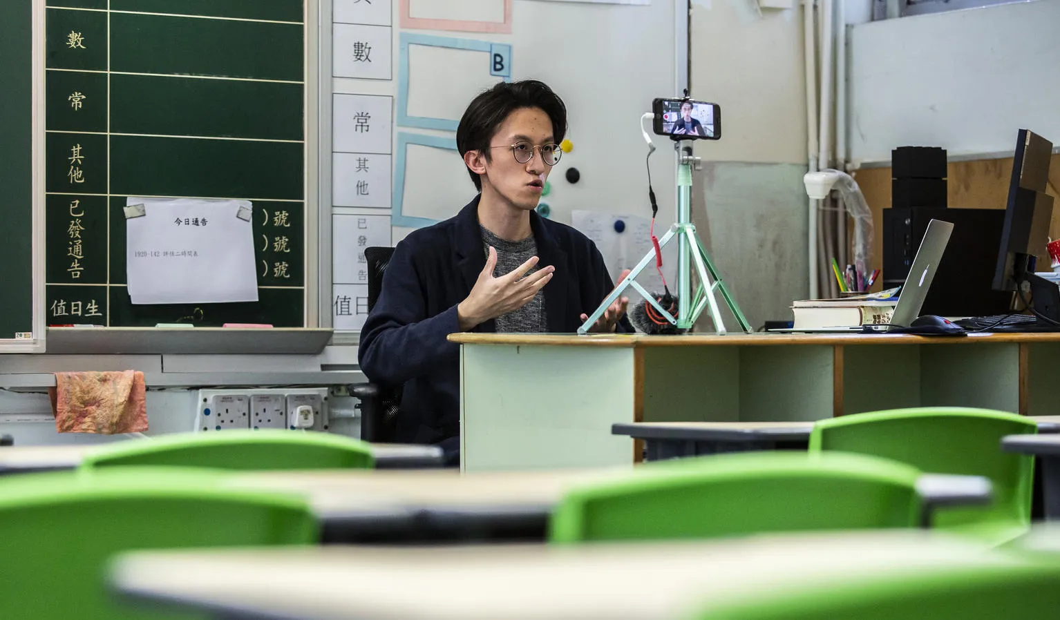 A primary school teacher records lessons for students in China.