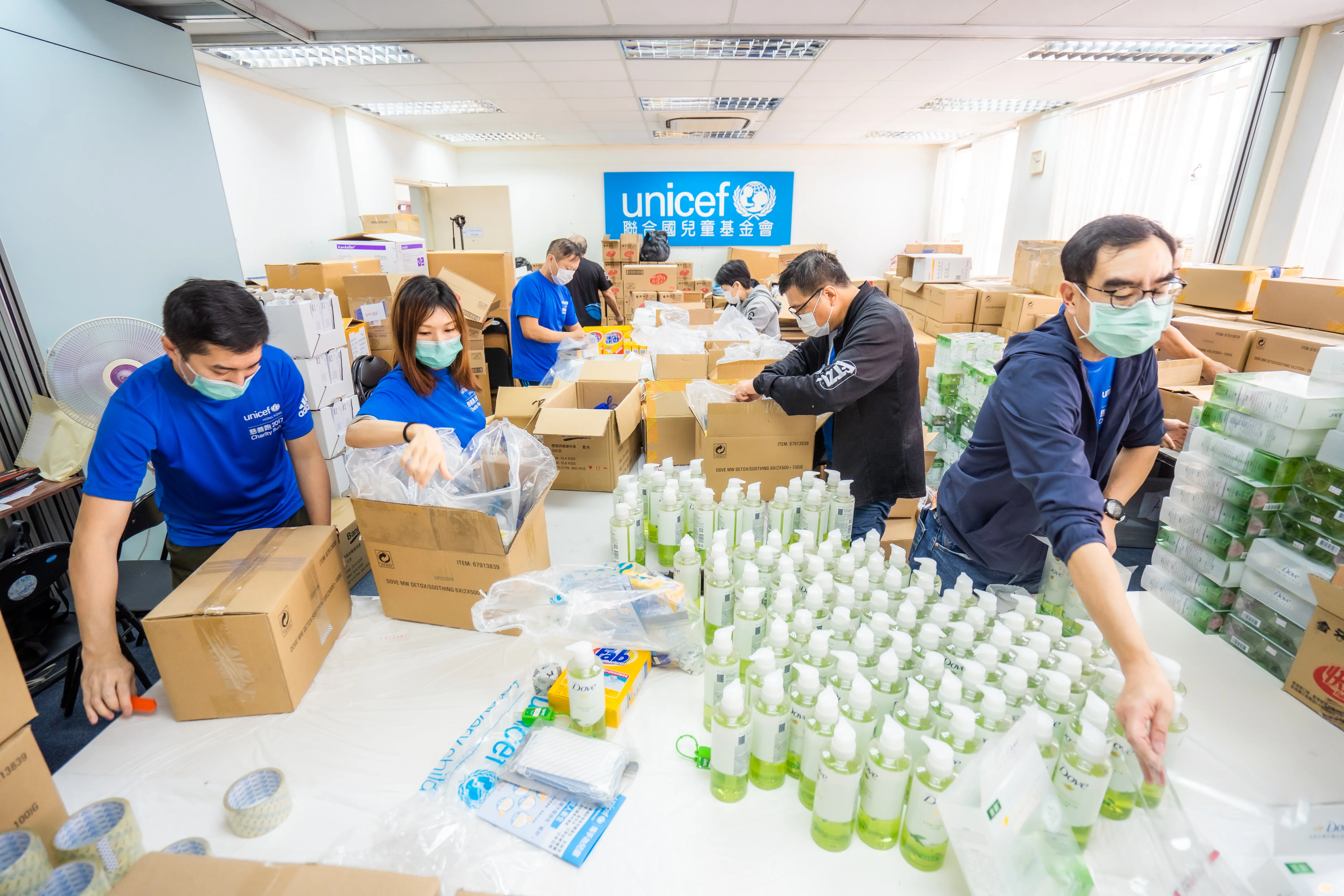 UNICEF workers sorting COVID-19 supplies