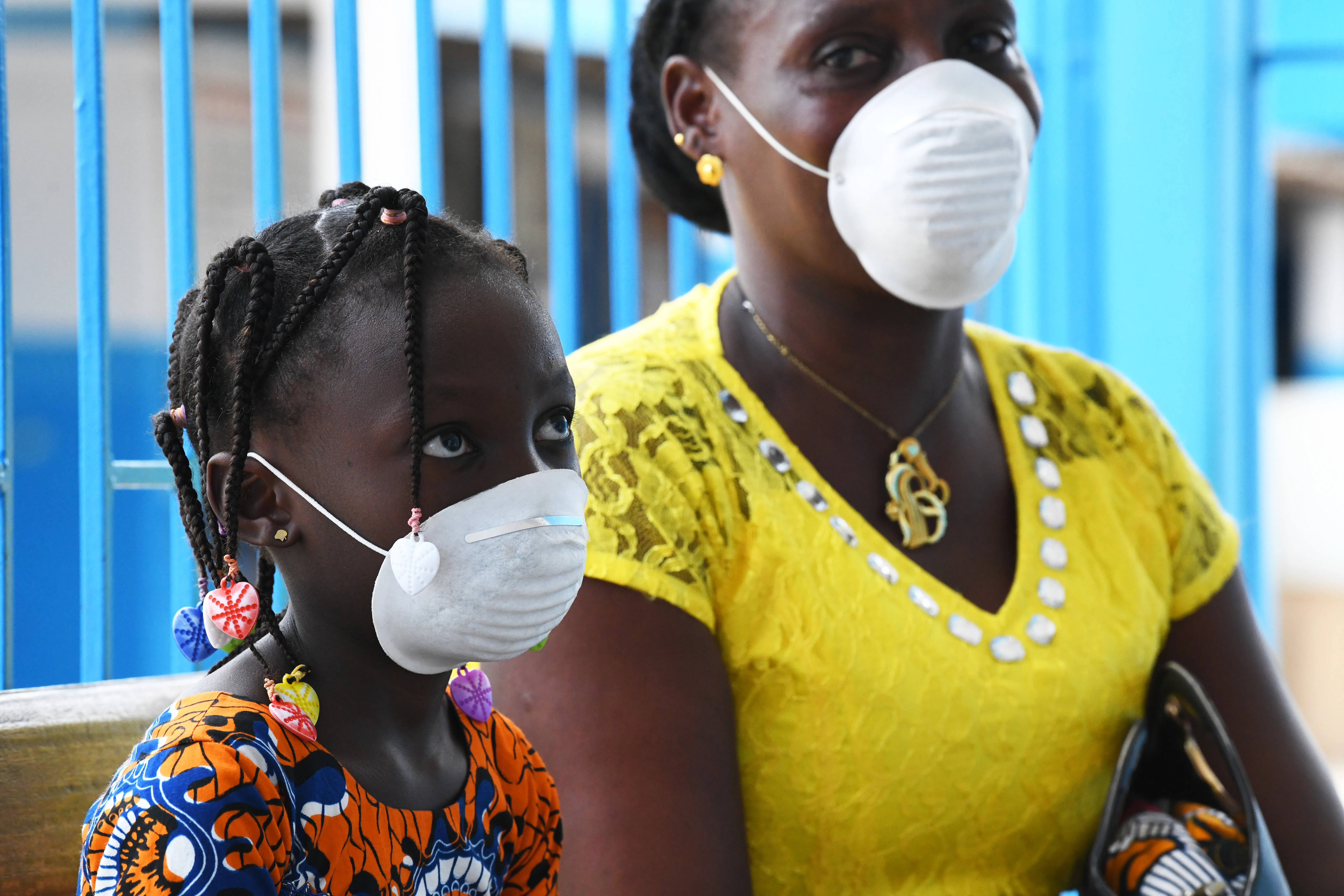 Mother and daughter wearing face masks