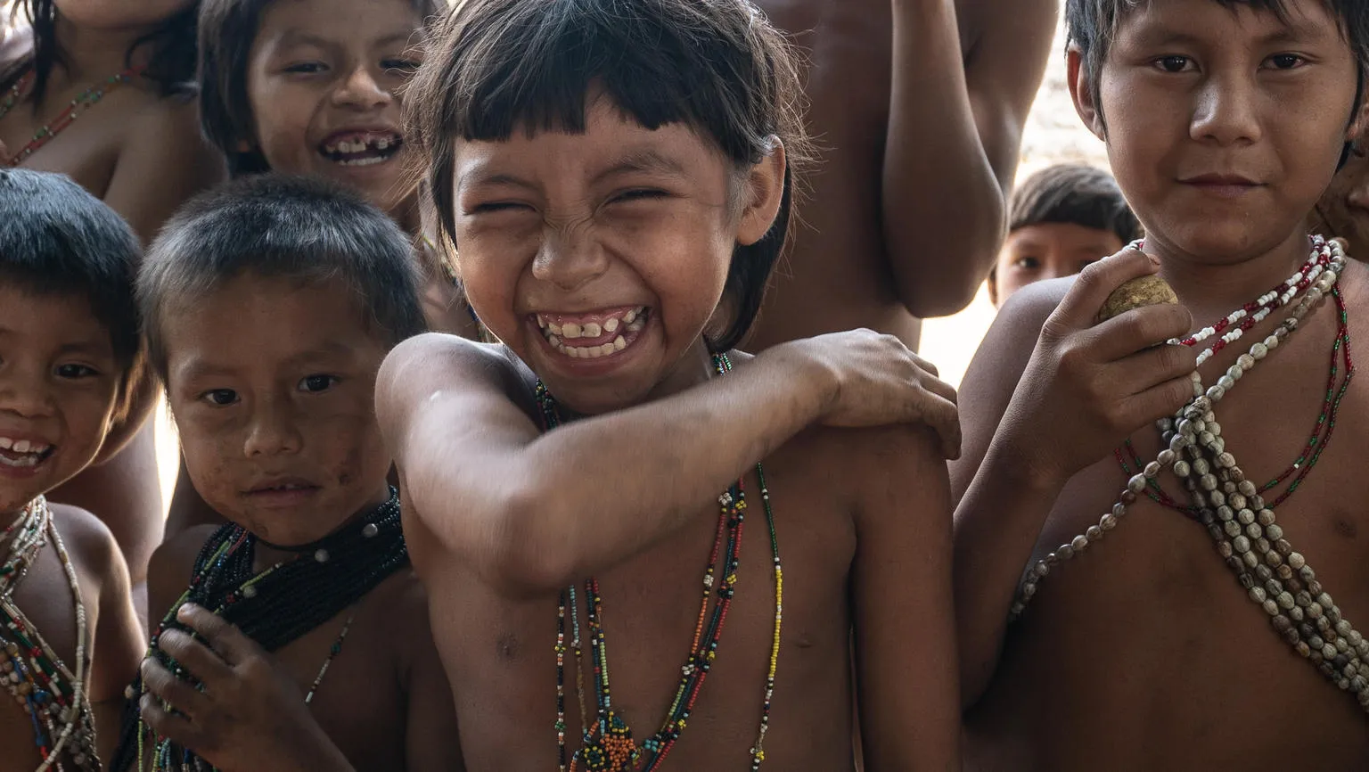 Children show off where they received vaccination shots.