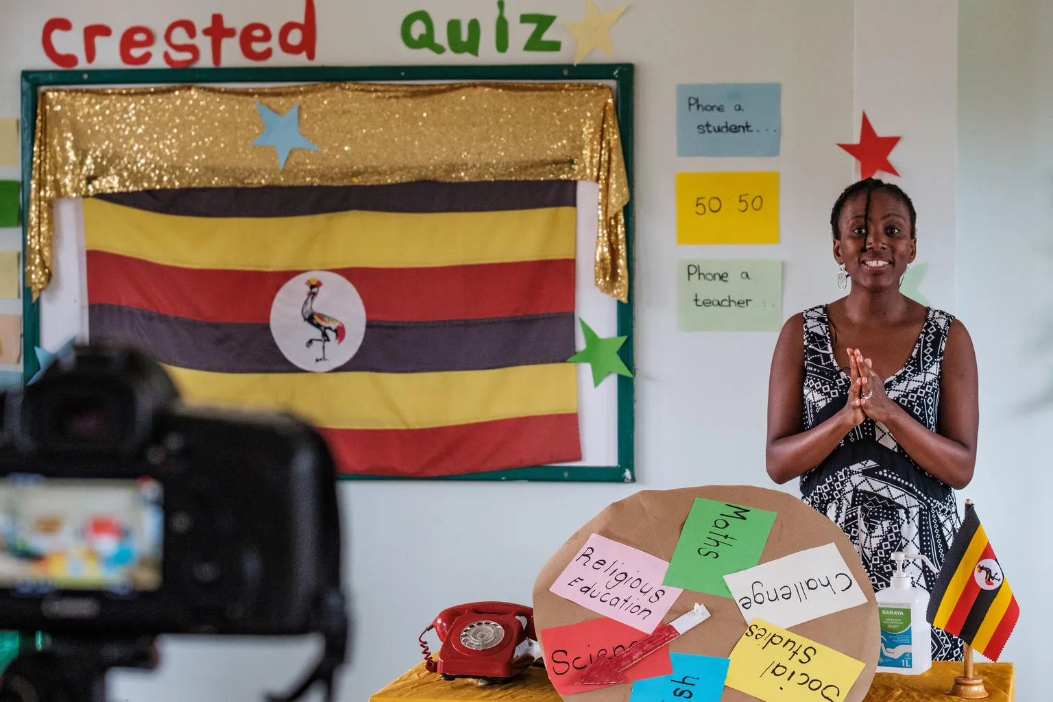 A teacher in Uganda records a lesson for a televised education broadcast.