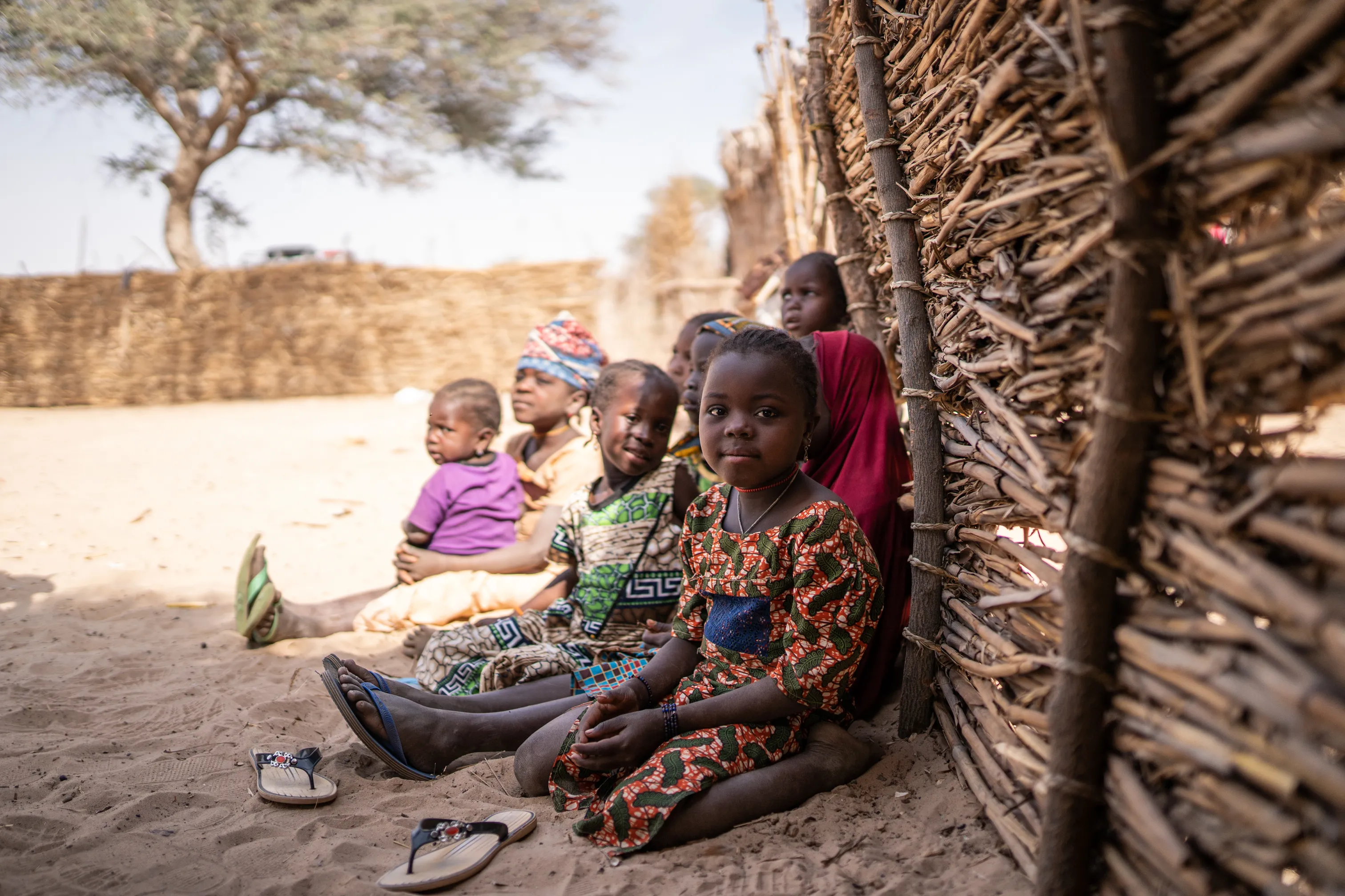 Children sitting on the ground