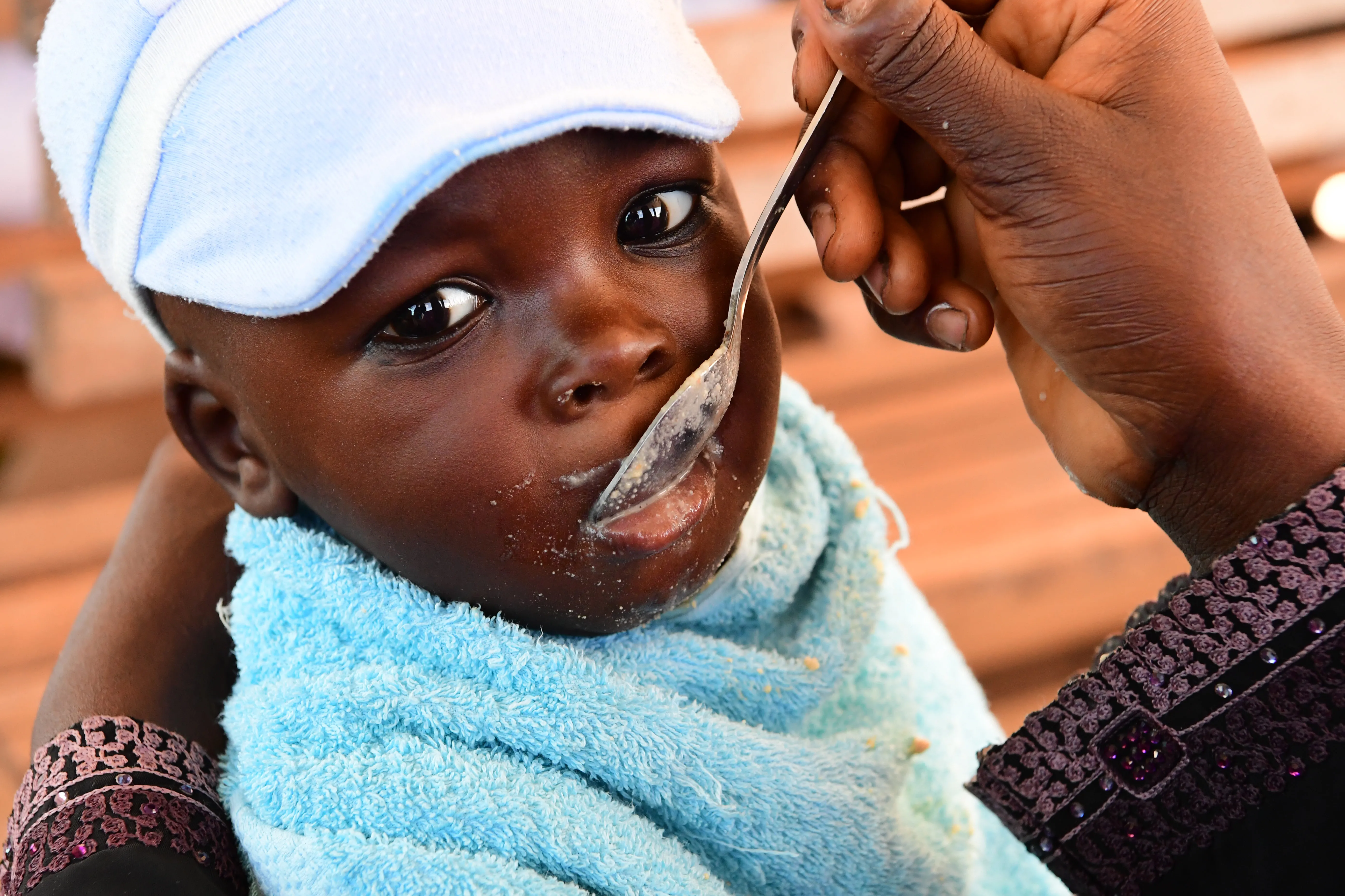 A mother feeding her baby at the Primature health center of San Pedro, in the South West of Côte d’Ivoire. 